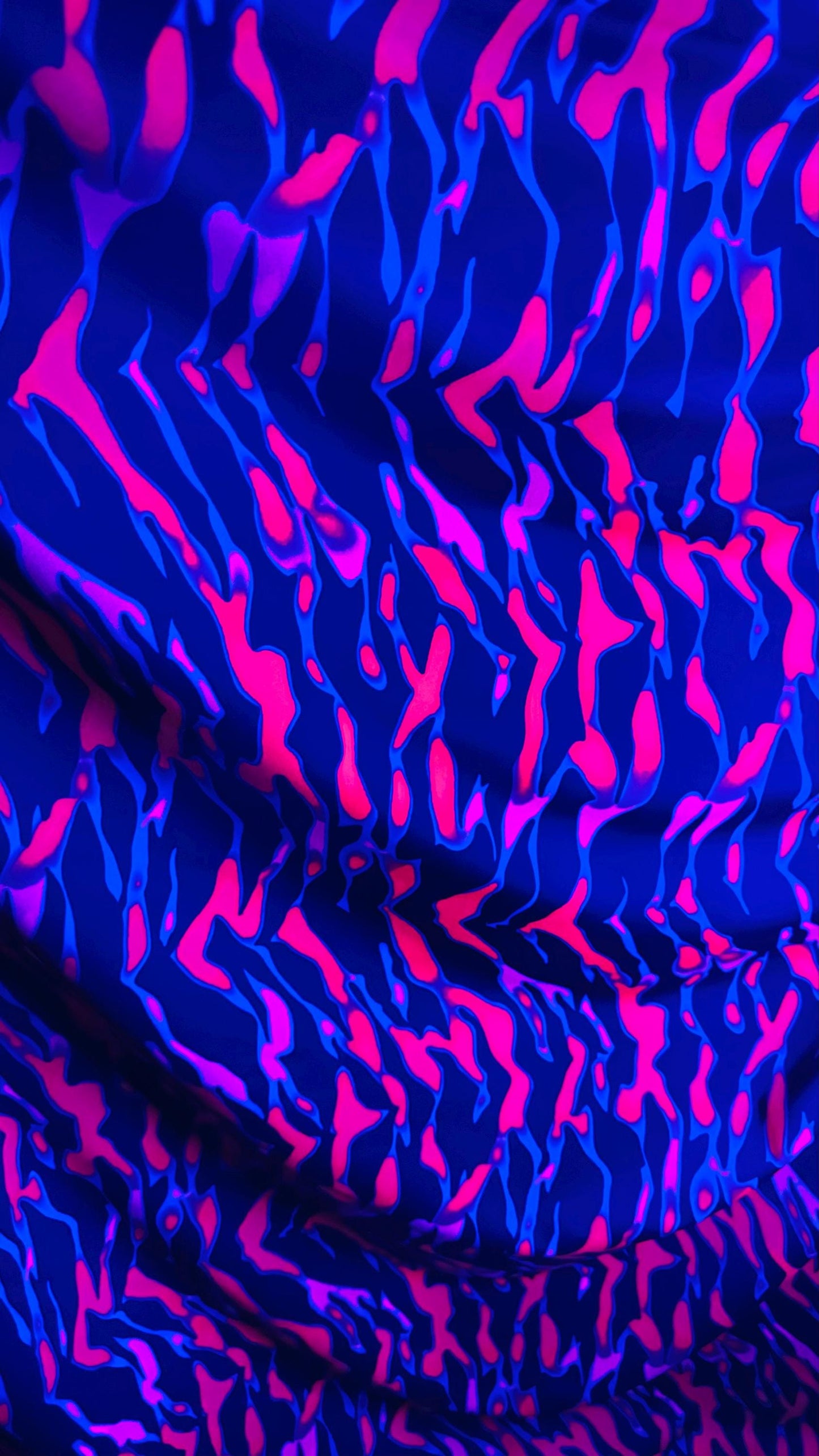 New UV light reflective Tiger abstract design Neon Pink/Black print on heavy nylon spandex 4-way stretch 58/60” Sold by the YD.