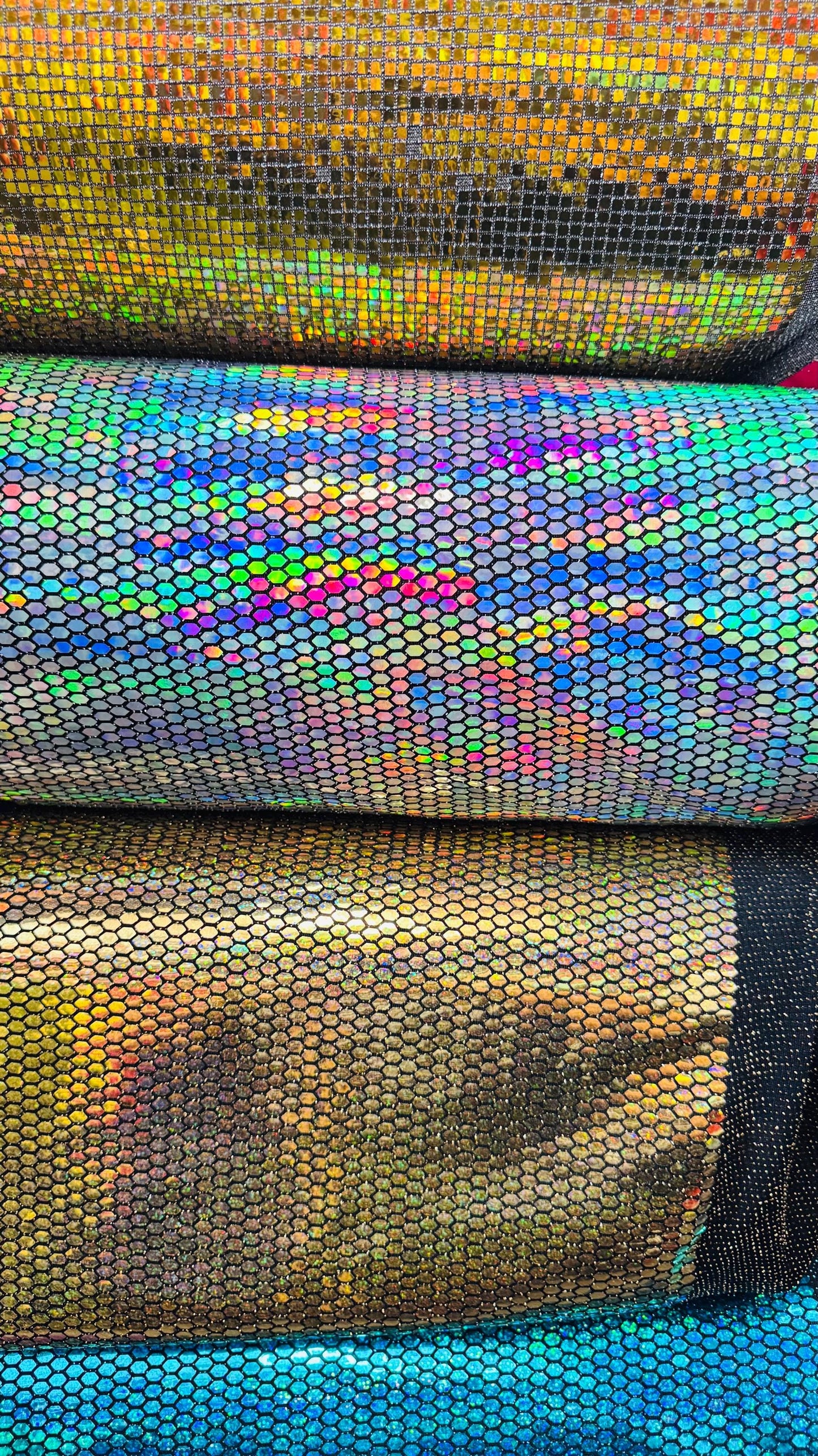 Honeycomb Hologram iridescent sequins trans on Nylon metallic 2-way stretch 58/60” Sold by the YD. Ships worldwide from Los Angeles Californ
