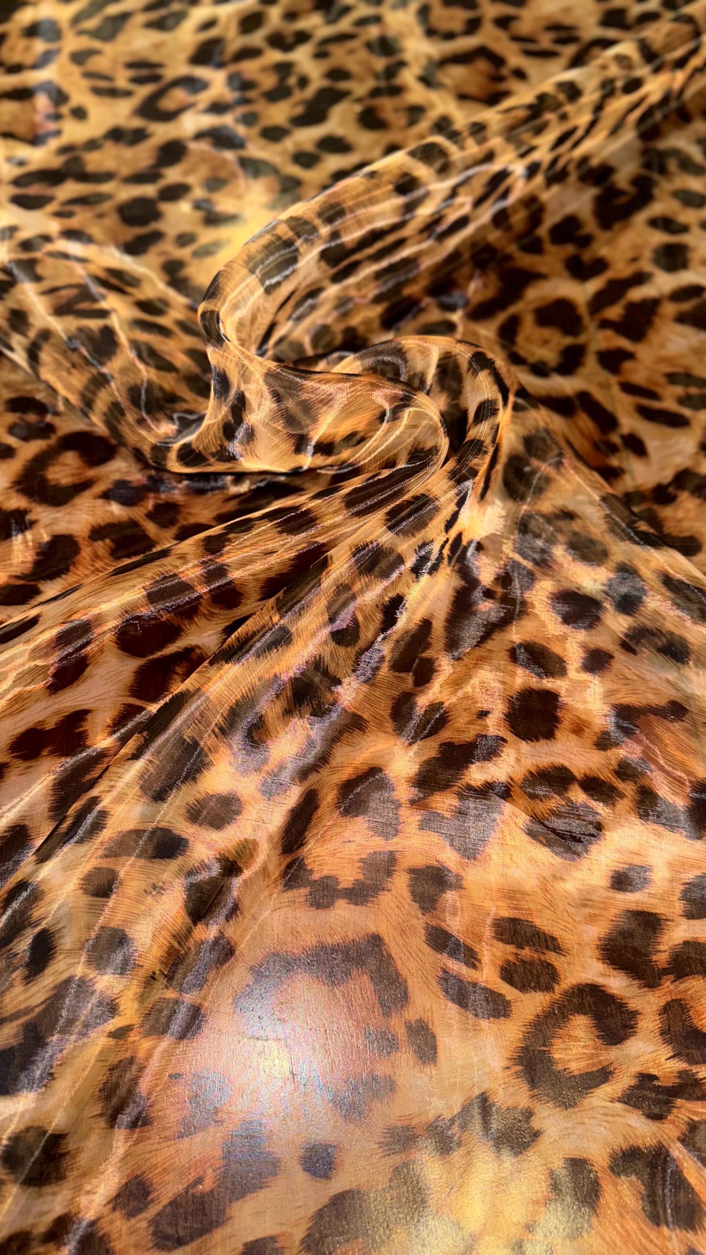 New Exotic Leopard design print on great quality of Mirror Silky Organza non stretch 58/60” Sold by the YD. Ships worldwide from LA CA