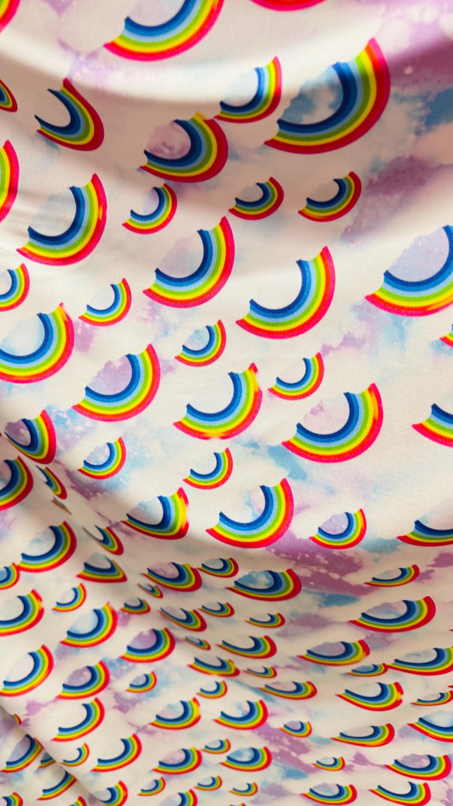 New Rainbow Clouds design print on nylon spandex 4way Stretch 58/60" Sold by the YD. Ships worldwide from Los Ángeles California USA.