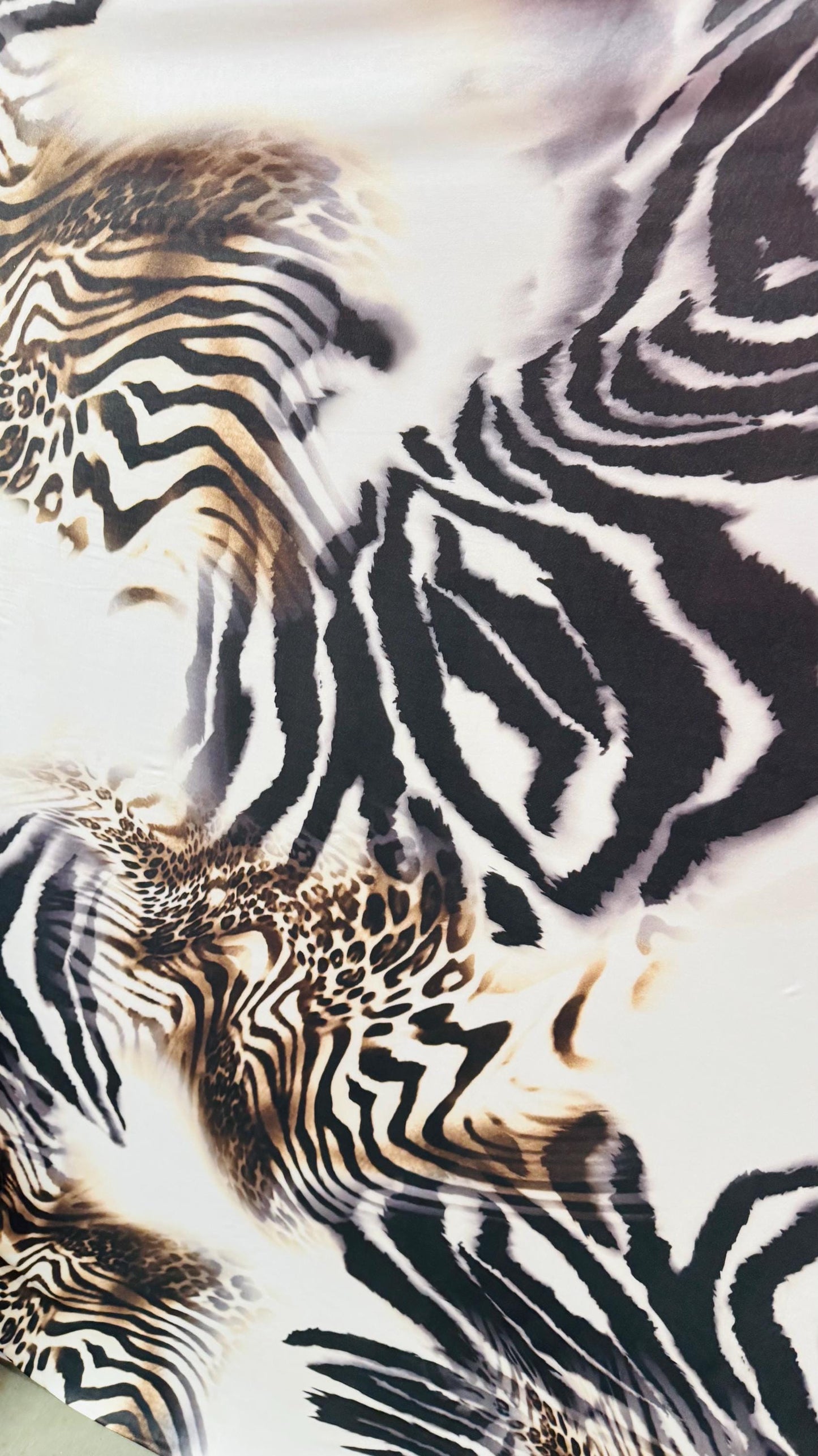 New Safari design Taupe/Brown print on poly spandex 4way stretch 58/60" Sold by the yd. Ships worldwide from Los Angeles California USA.
