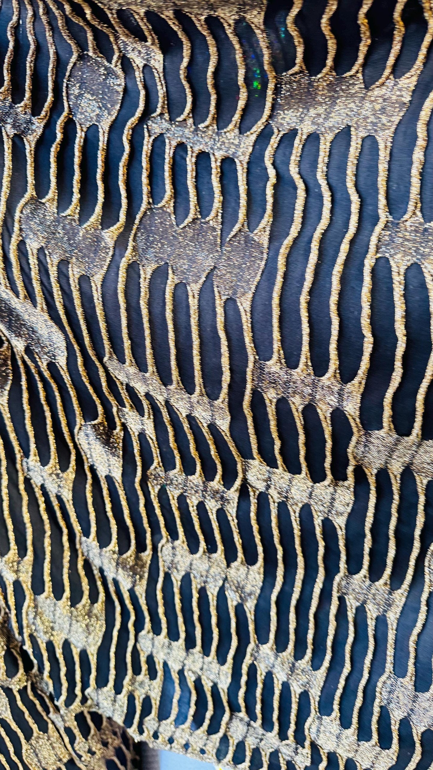 Mummy design Metallic poly spandex 4-way stretch 58/60” Sold by the YD. Ships Worldwide from Los Angeles California USA