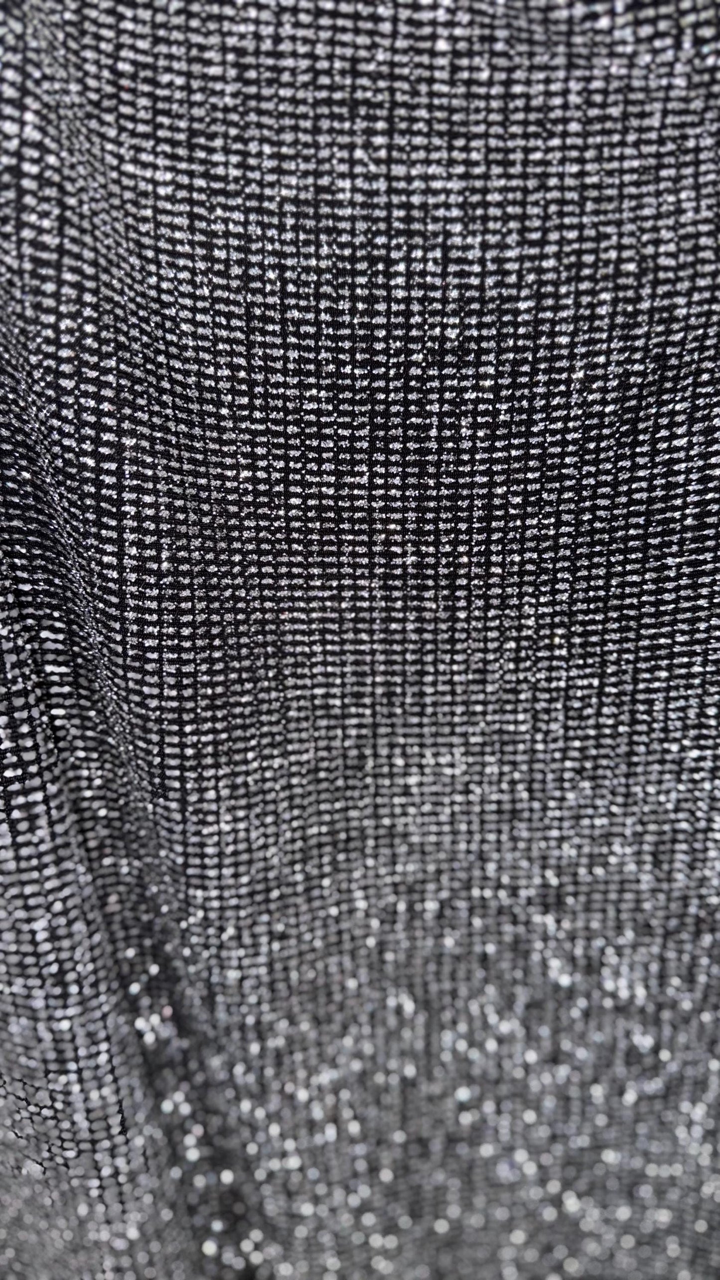 Slinky Geometric design with glitter black/silver 4way stretch 58/60" Sold by the YD. Ships worldwide from Los Angeles California USA.