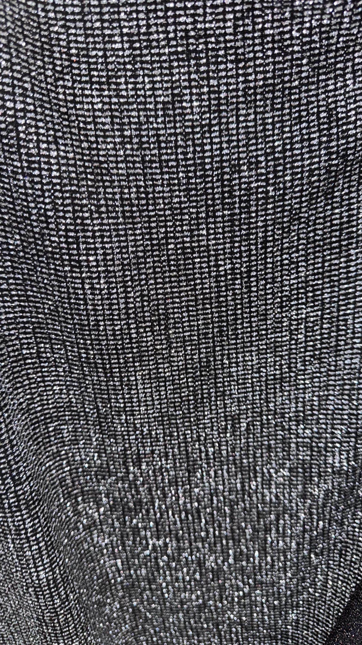 Slinky Geometric design with glitter black/silver 4way stretch 58/60" Sold by the YD. Ships worldwide from Los Angeles California USA.