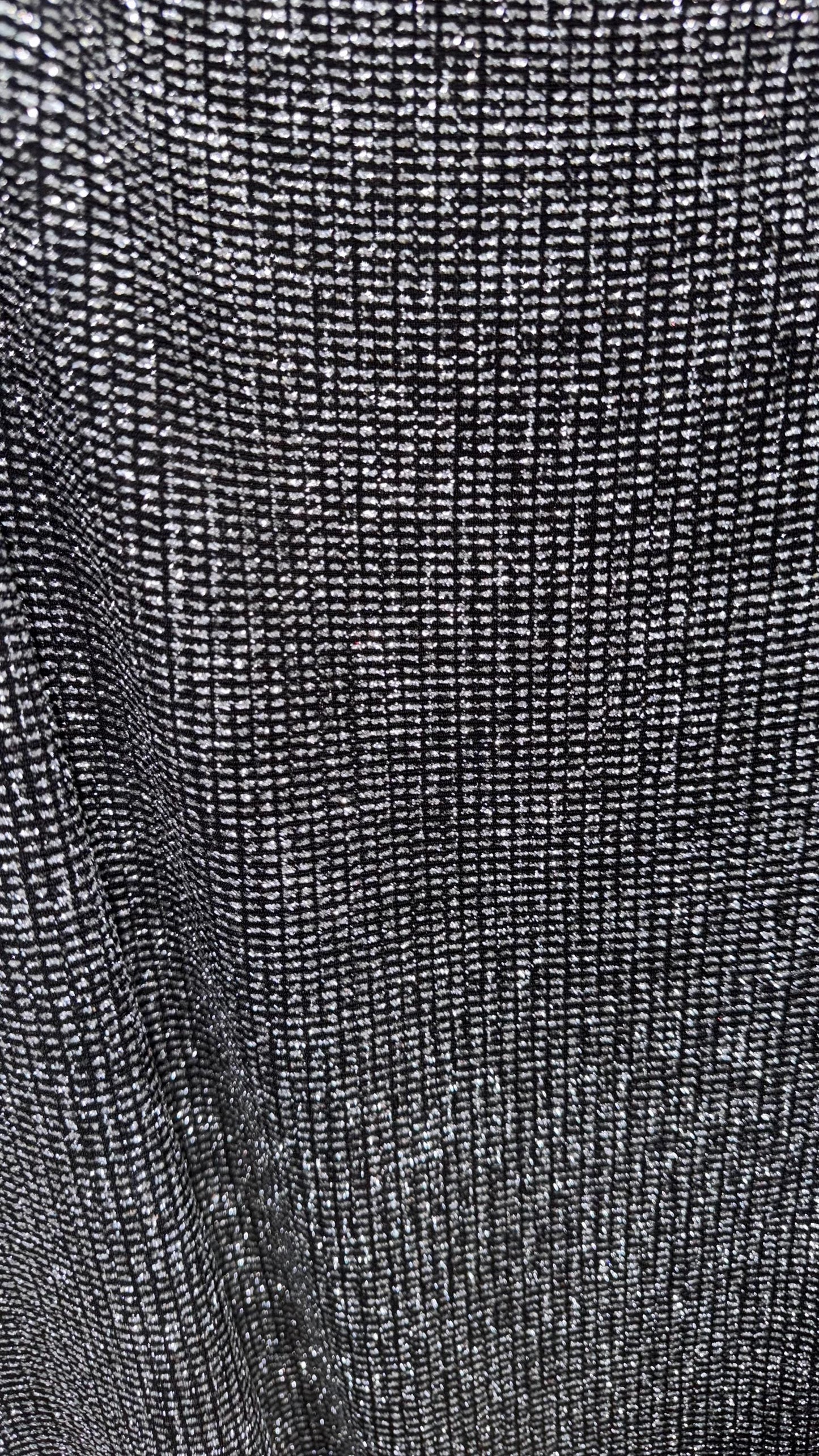 Slinky Geometric design with glitter black/silver 4way stretch 58/60" Sold by the YD. Ships worldwide from Los Angeles California USA.