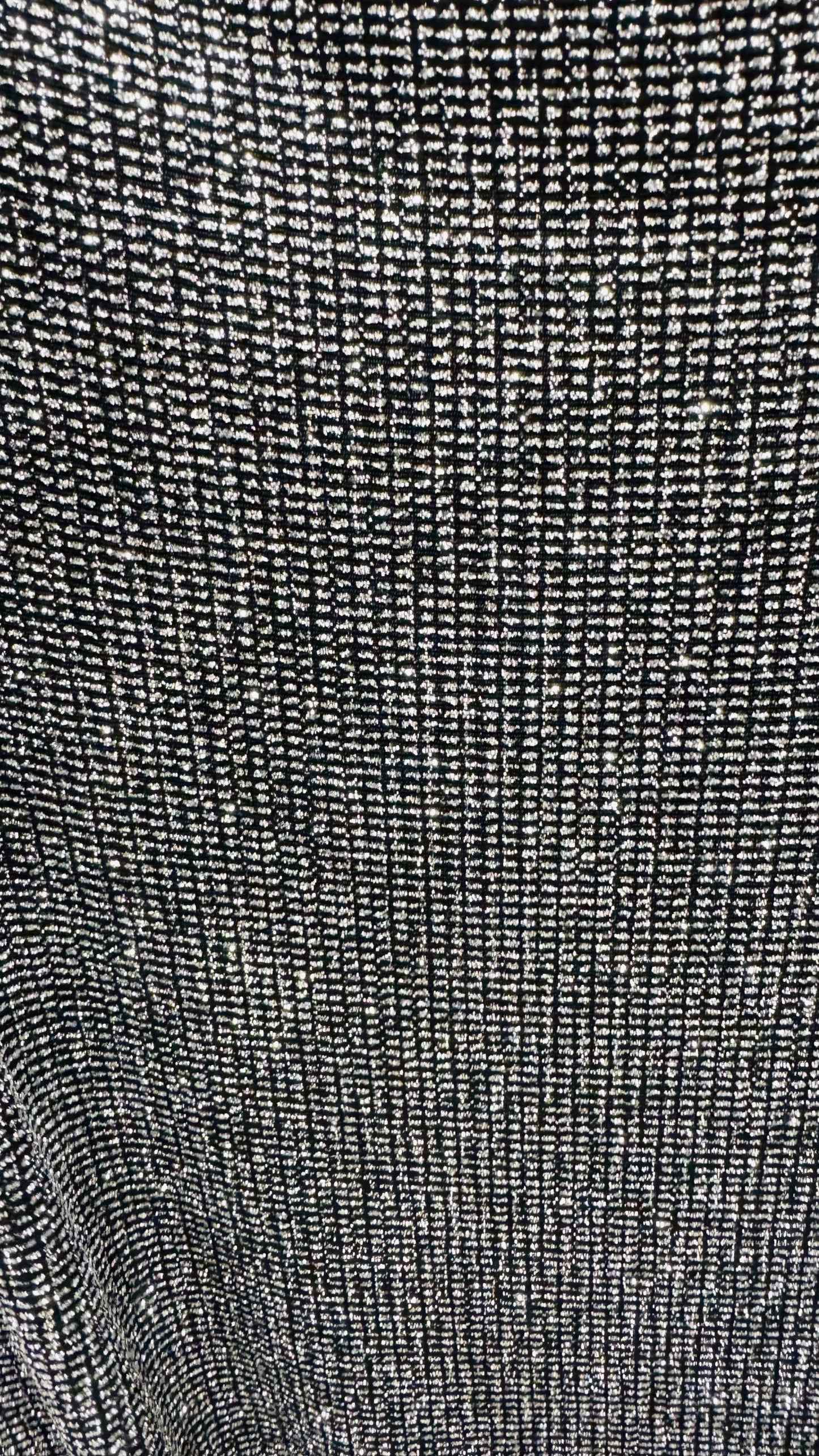 Slinky Geometric design with glitter black/silver 4way stretch 58/60" Sold by the YD. Ships worldwide from Los Angeles California USA.