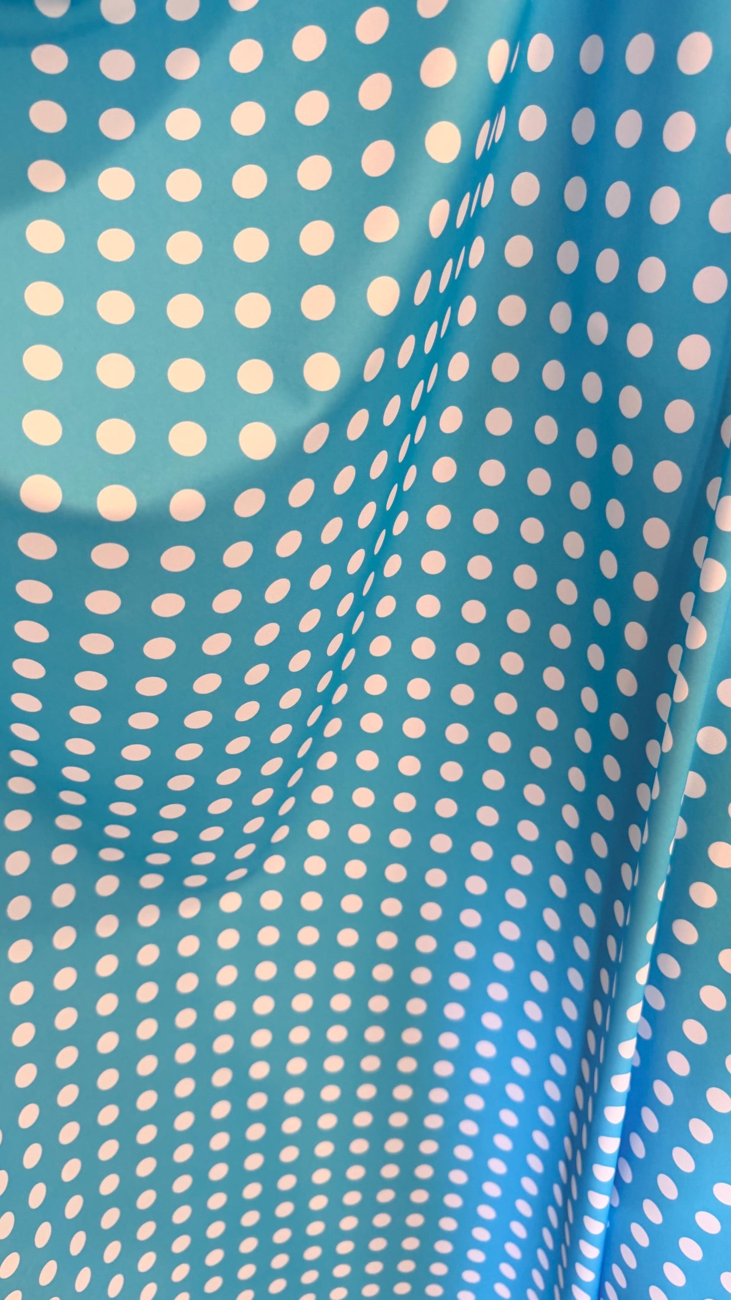 Polka dots design Aqua/White print on nylon spandex 4way stretch 58/60" sold by the Yd. Ships worldwide from Los Angeles California USA.