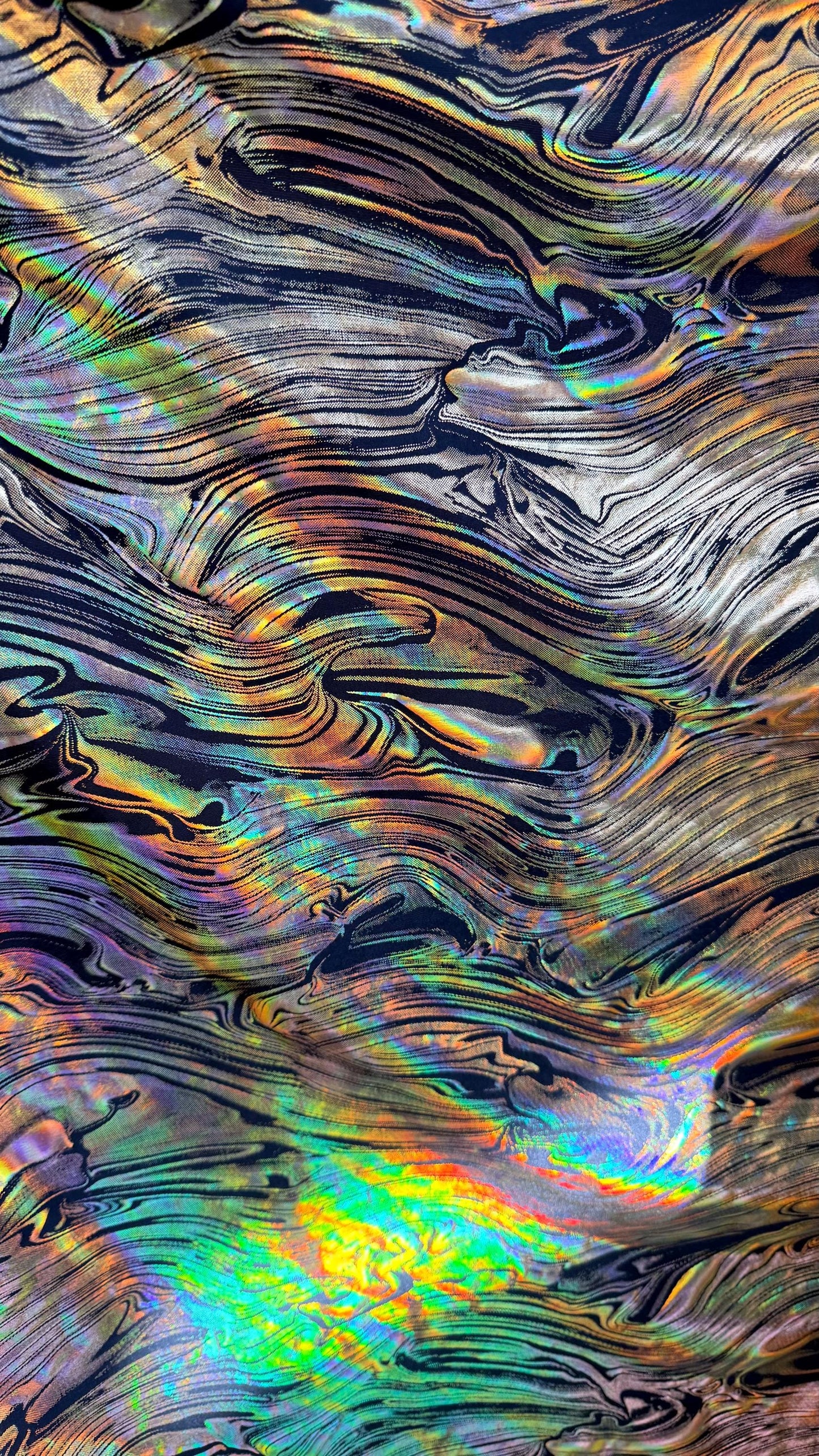 New Abstract design Iridescent metallic poly spandex 4way stretch 58/60" Sold by the YD. Ships worldwide from Los Angeles California USA.