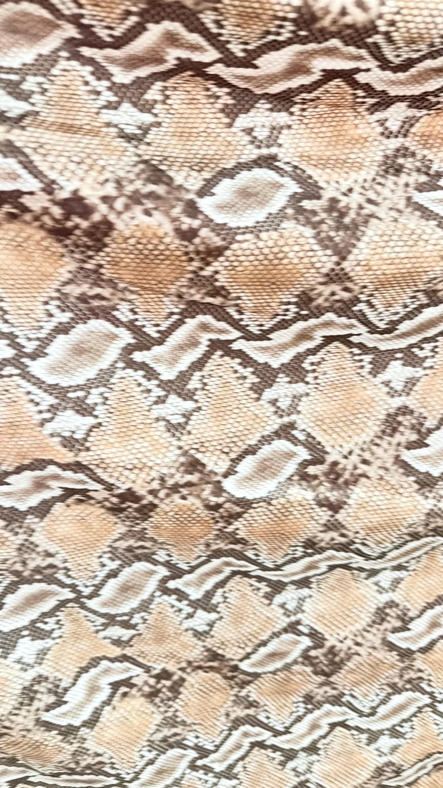 New Mamba Exotic snake design Taupe/black print on best quality of nylon spandex 4-way stretch 58/60” Sold by the YD. Ships worldwide