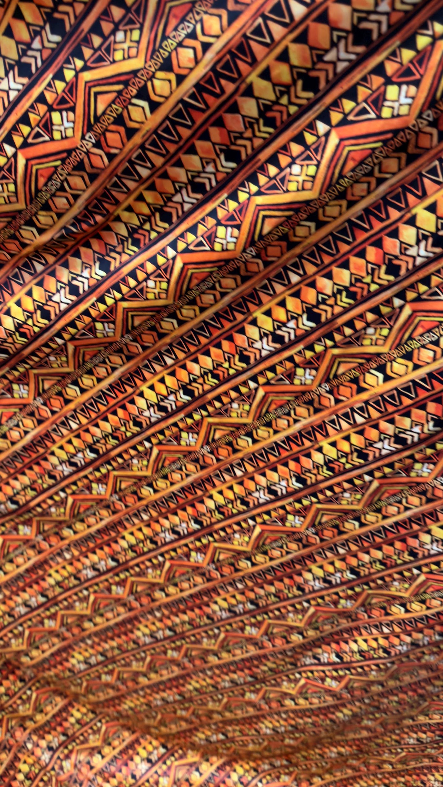 AZTEC design Yellow/Orange on nylon spandex 4way Stretch 58/60" Sold by the yd Ships worldwide from Los Angeles California USA.