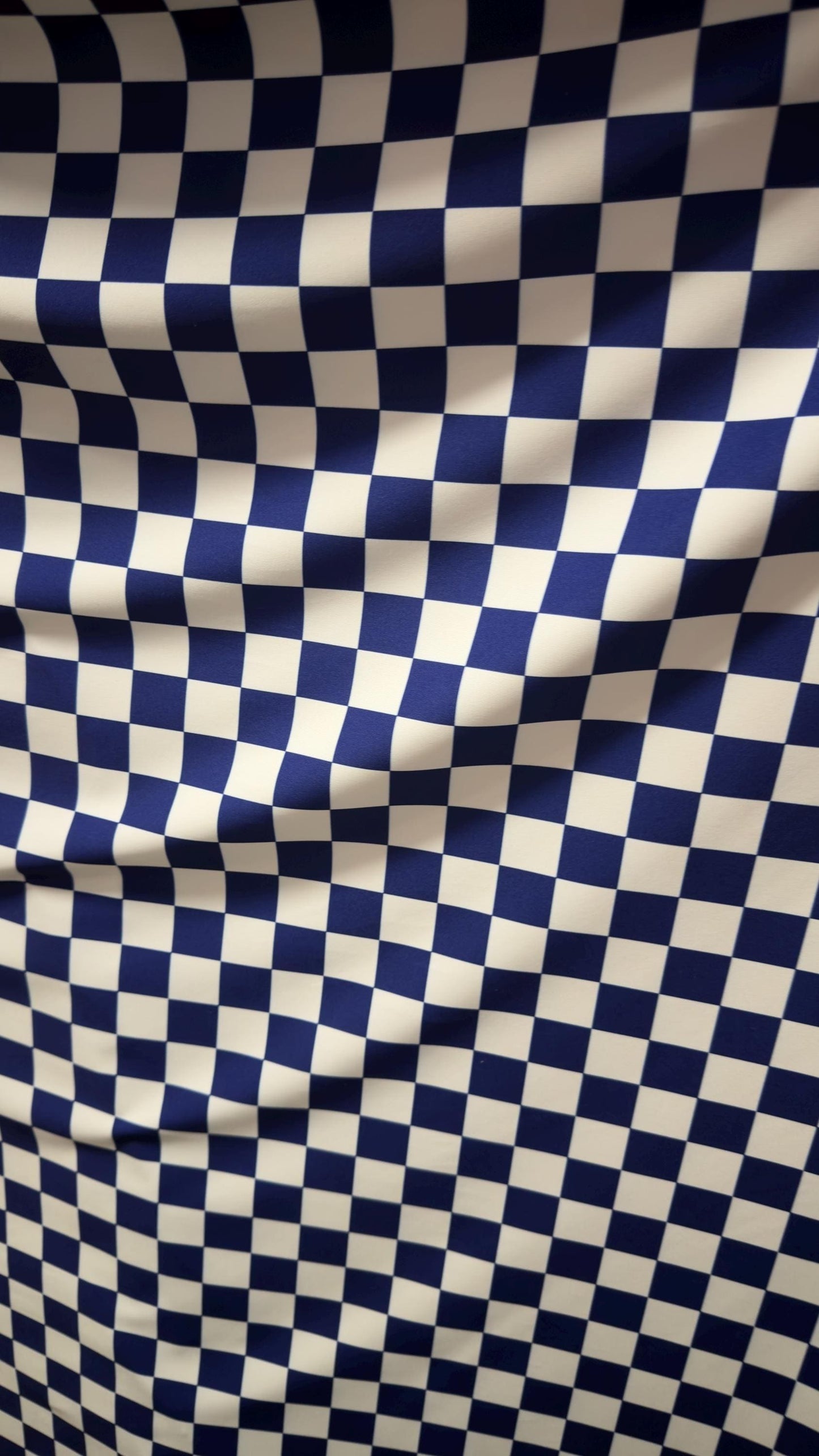 Sapphire/White Checkered design 1" print on nylon spandex 4way stretch 58/60" Sold by the YD. Ships worldwide from Los Angeles California