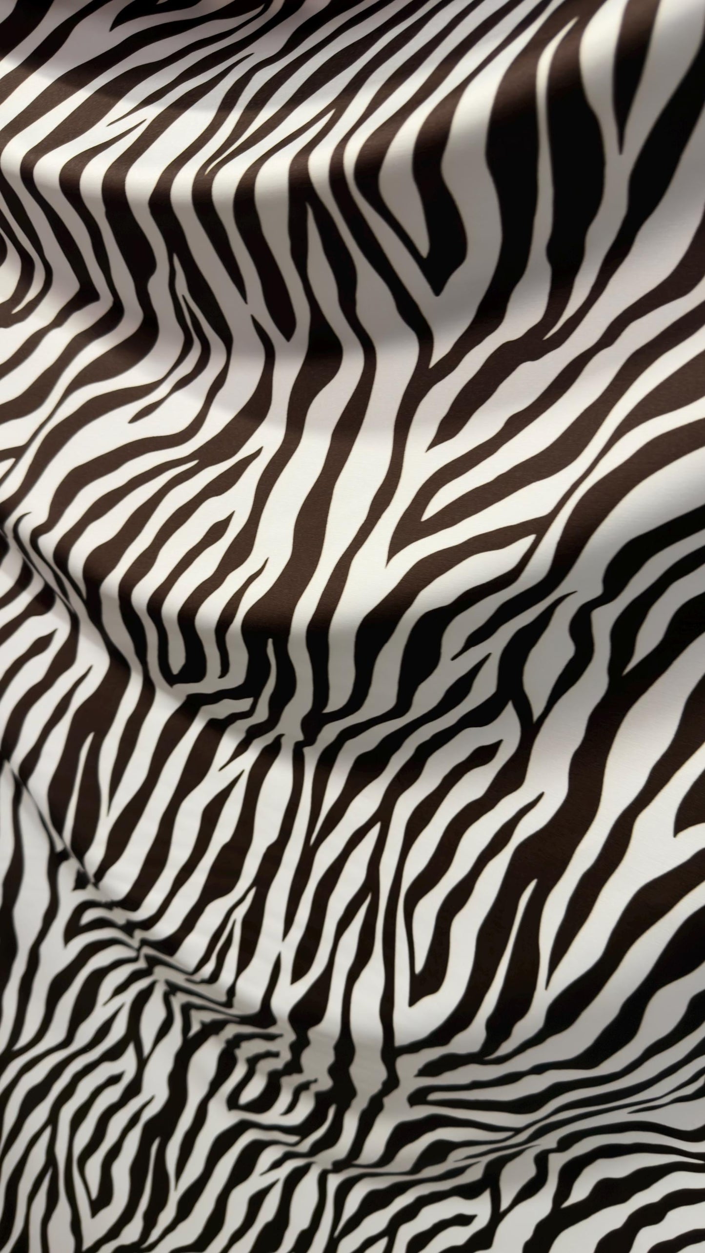 New exotic Brown zebra design print on nylon spandex 4-way Stretch 58/60” Sold by the YD. Ships worldwide from Los Angeles California USA.