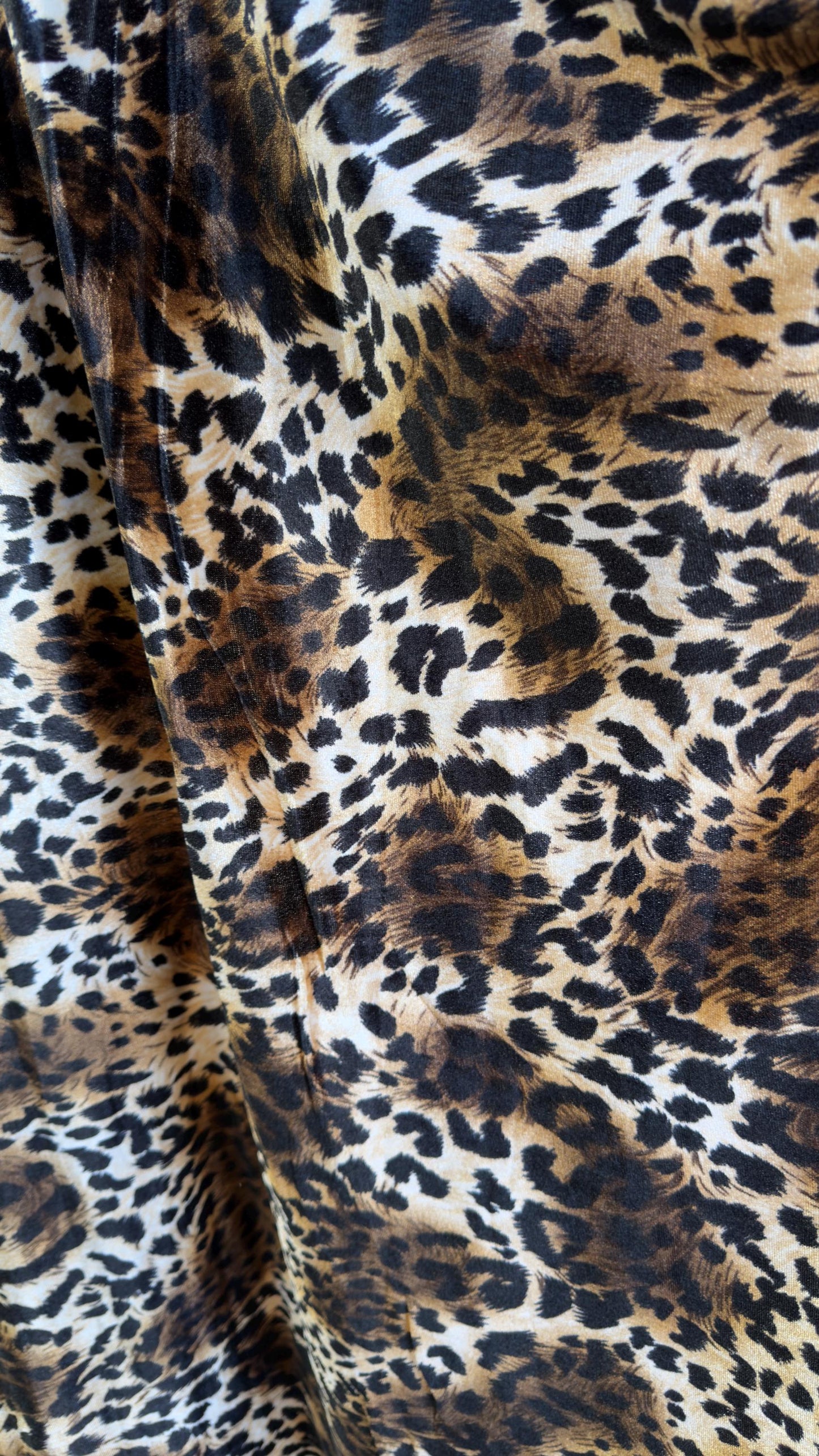 New Leopard print Brown/Black on heavy stretch velvet 4way stretch 58/60" Sold by the YD. Ships worldwide from Los Ángeles California USA.