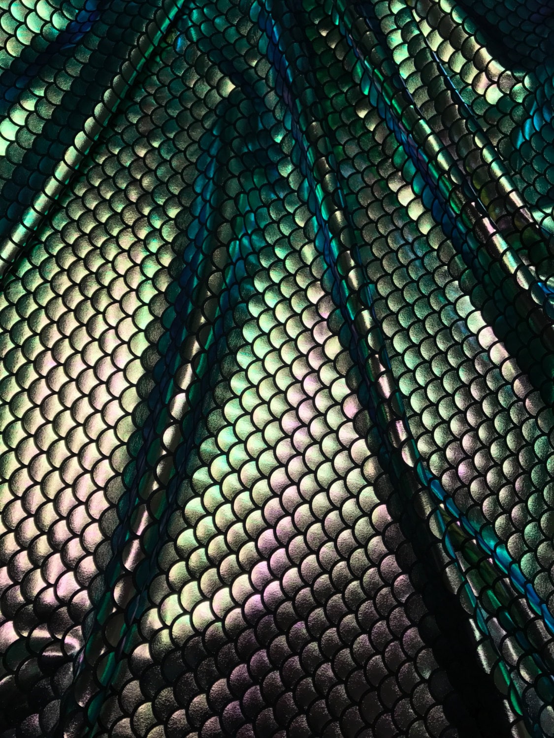 Iridescent green mermaid fish scale design. Spandex Fabric 4way. Sold by the yd. 60" inches