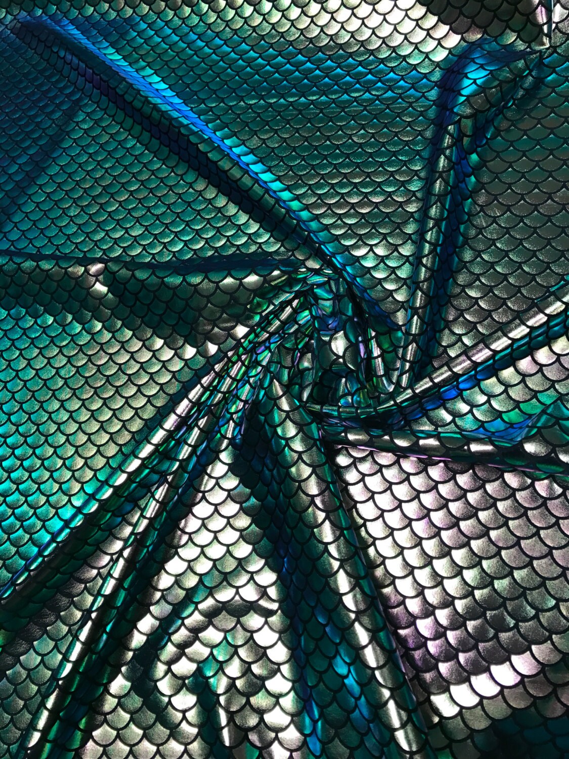 Iridescent green mermaid fish scale design. Spandex Fabric 4way. Sold by the yd. 60" inches