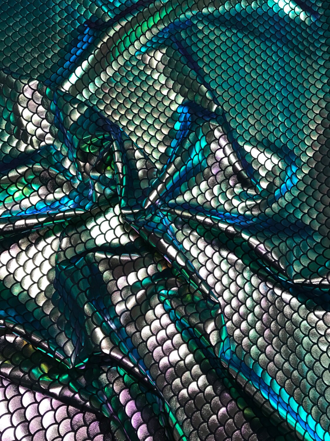 Iridescent green mermaid fish scale design. Spandex Fabric 4way. Sold by the yd. 60" inches