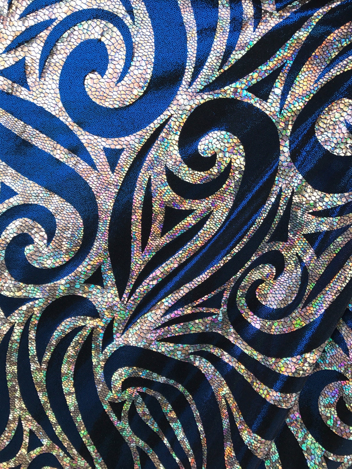 Nylon Spandex foggy foil with swirl hologram design. 58/60" Sold by the Yd. Ships worldwide from Los Angeles CA United States.