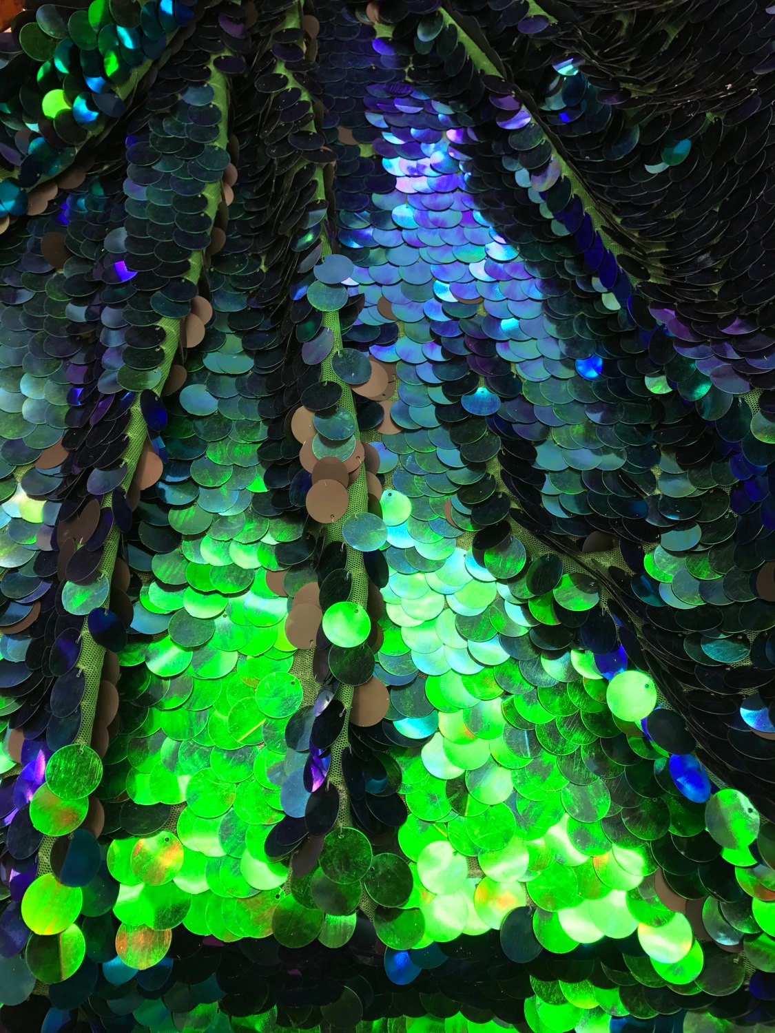 Iridescent mermaid green big paillette sequins on stretch mesh base 2way 58/60" Sold by the YD. Ships worldwide from Los Angeles California