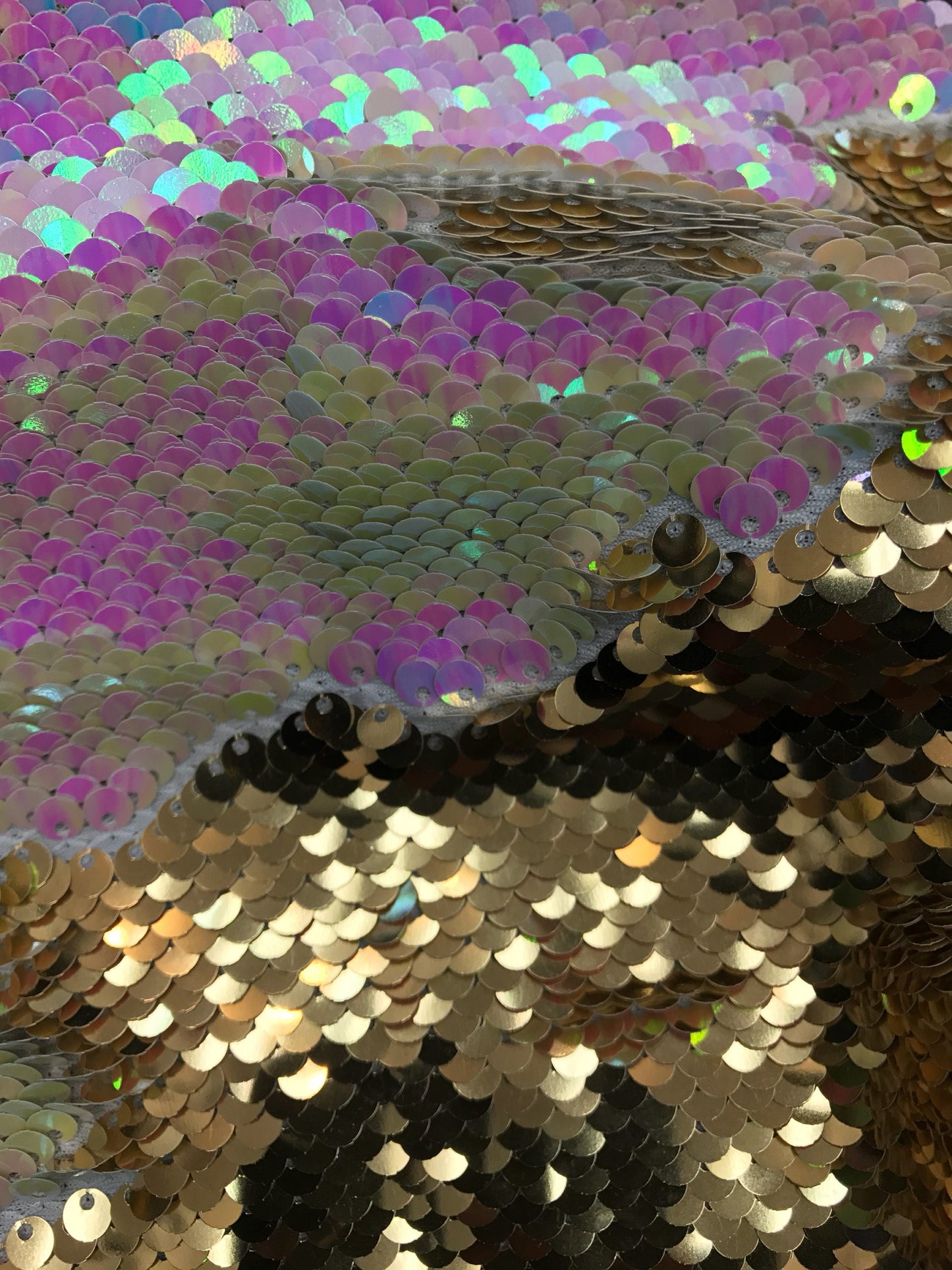 New flip up sequins iridescent white/gold on spandex base2 way stretch 58/60" Sold by the YD. Ships worldwide from Los Angeles California.