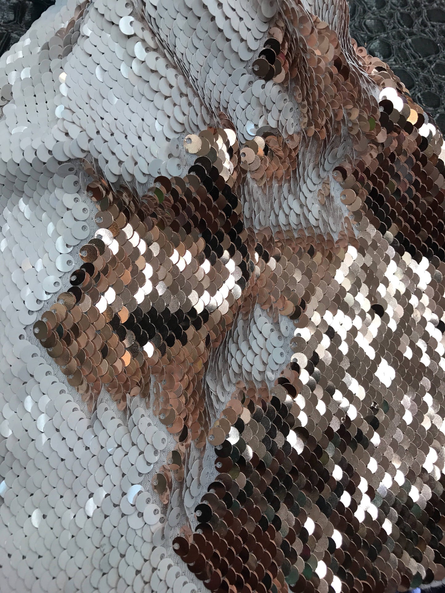 New flip up sequins Rose/gold on spandex base 2 way stretch 58/60" Sold by the YD. Ships worldwide from Los Angeles California.