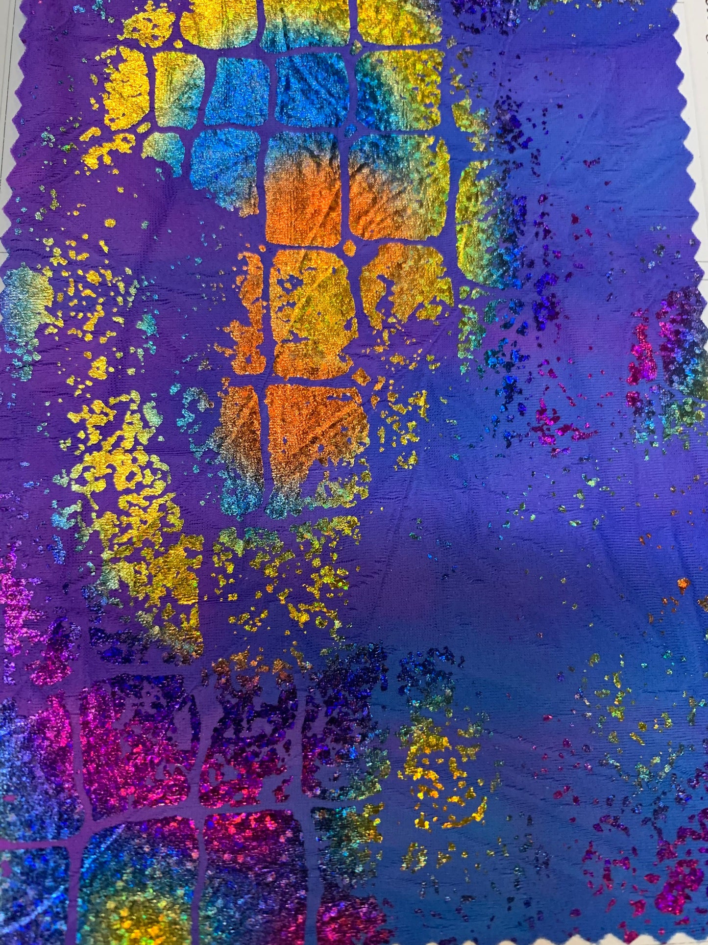 New tie dye jungle snake design hologram metallic nylon spandex with foil 4-way stretch 58/60” Sold by the YD. Ships worldwide from L.A CA.