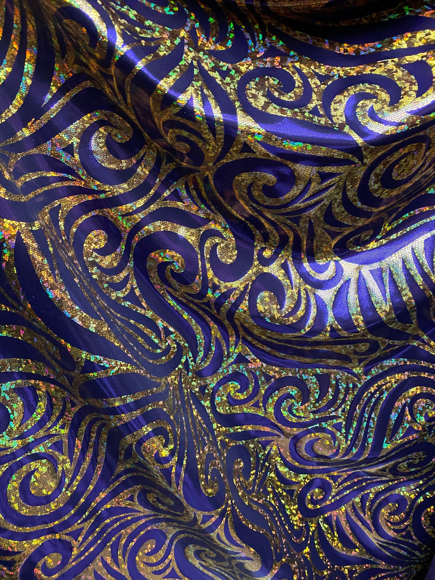 Spartan design metallic nylon spandex doble foil hologram Eggplant/gold 4-way stretch 58/60” Sold by the YD. Ships worldwide from L.A CA.