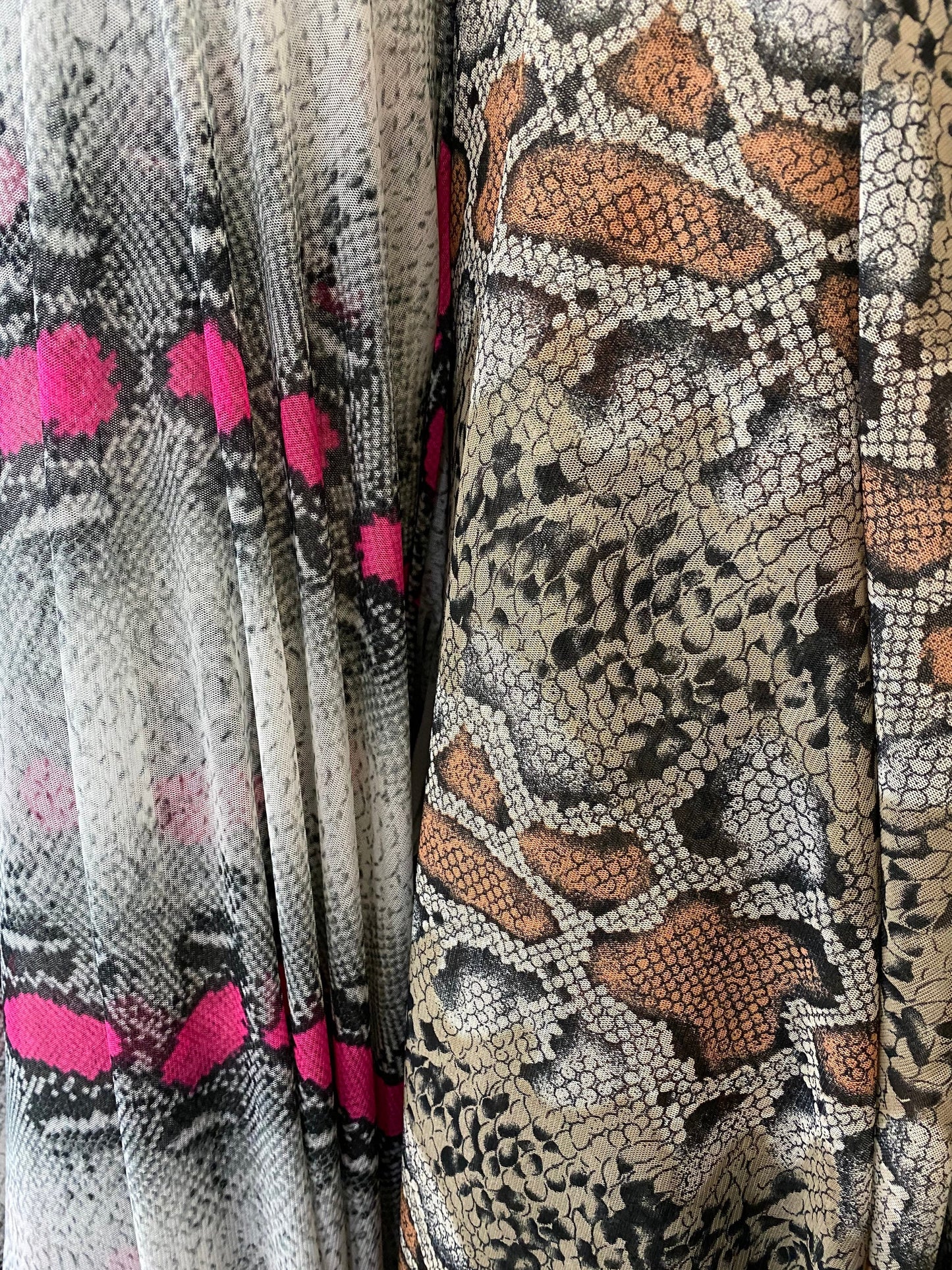 New Exotic snake design power mesh Gray/pink and Nude/green it glows in the dark under UV light 4-way Stretch 58/60” Sold by the YD. Ships worldwide