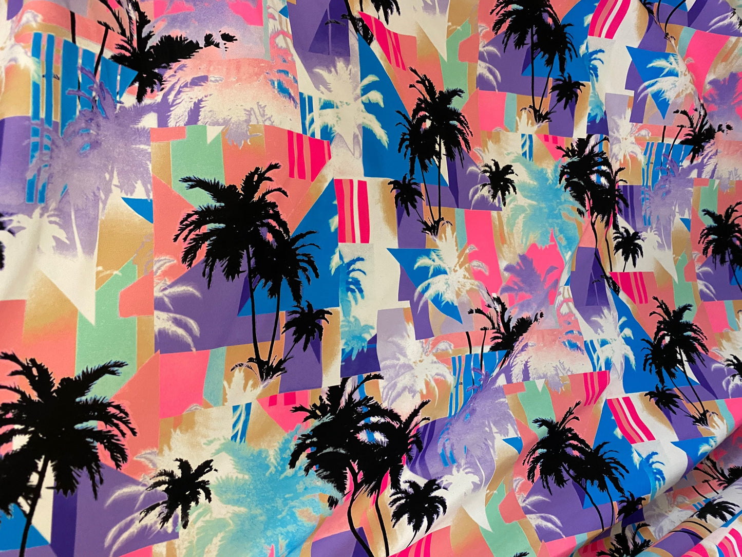 New palms trees design print on nylon spandex 4-way stretch 58/60” Sold by the YD. Ships worldwide from Los Angeles California USA.