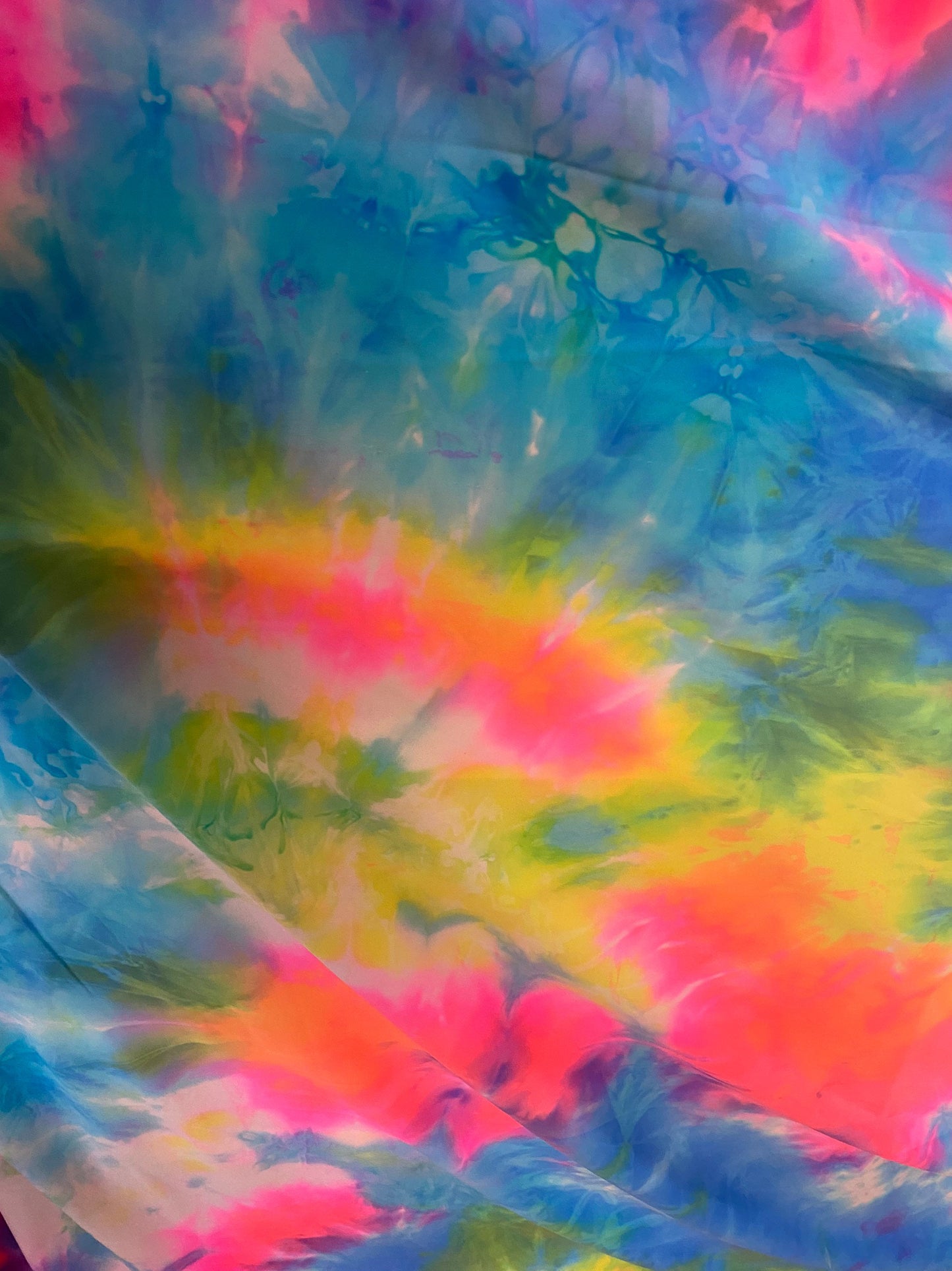 Rainbow tie dye great quality nylon spandex 4-way stretch 58/60” Sold by the YD. Ships worldwide from Los Angeles California USA.