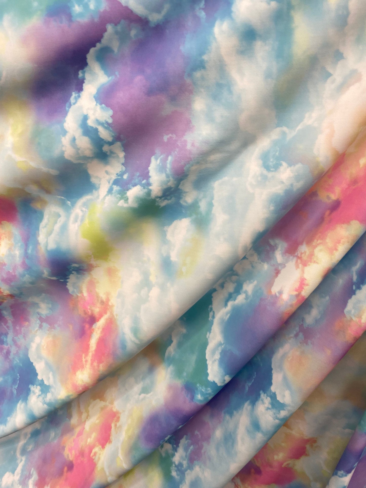 New clouds design print on nylon spandex 4way Stretch blue multicolor 58/60" Sold by the yd. Ships worldwide from Los Angeles California US