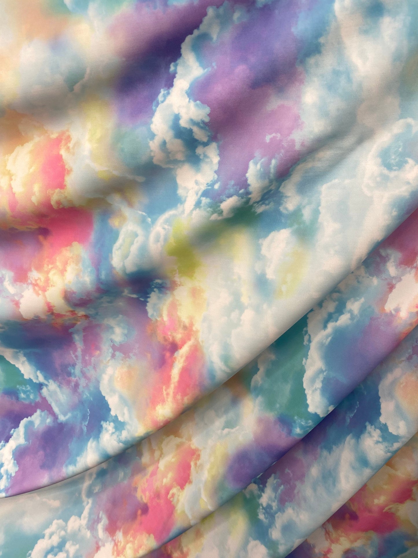New clouds design print on nylon spandex 4way Stretch blue multicolor 58/60" Sold by the yd. Ships worldwide from Los Angeles California US