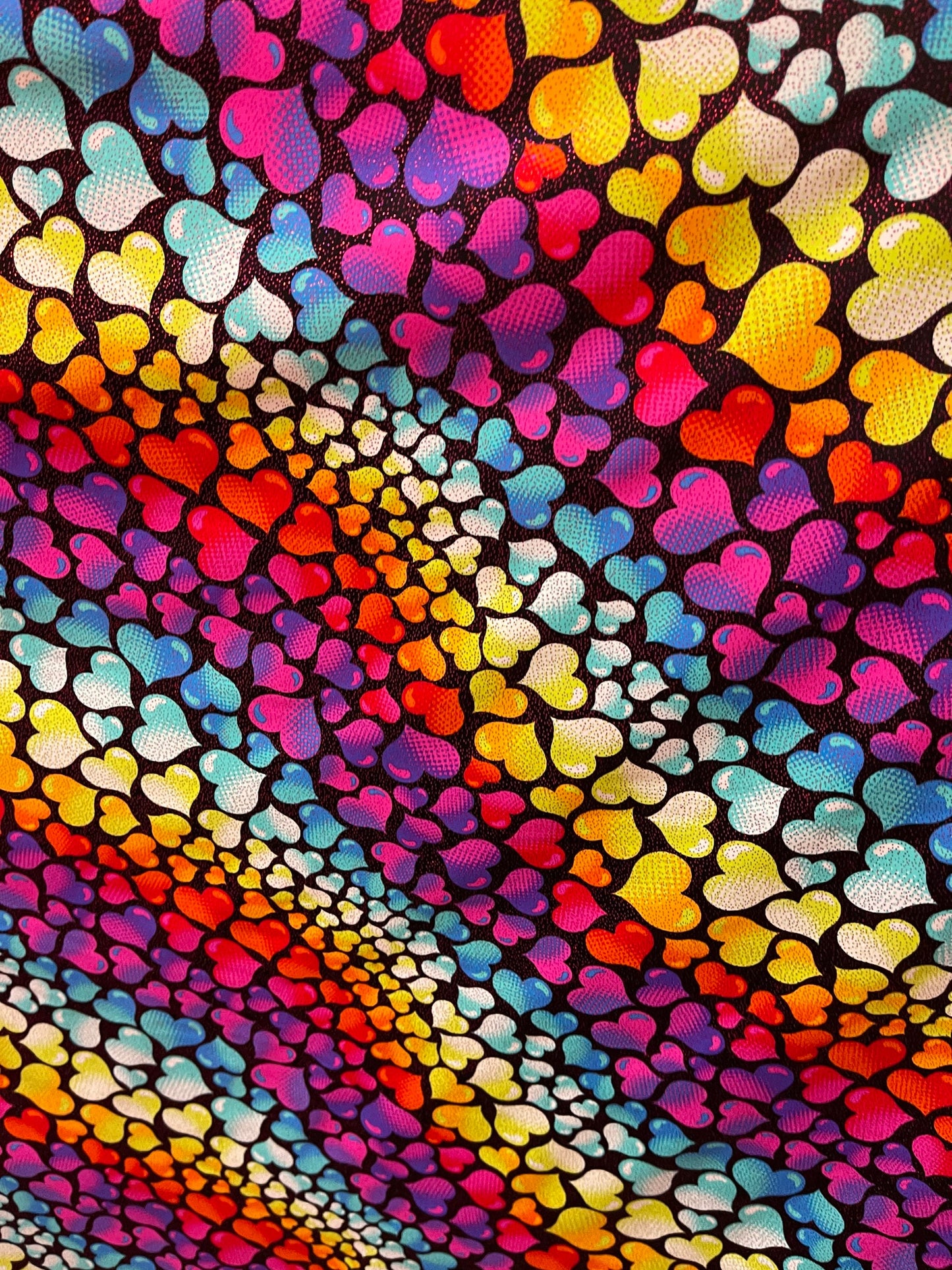 Romantic Love me Hearts design black/multicolor print on best quality of nylon spandex with foil 4-way stretch 58/60” Sold by the YD.