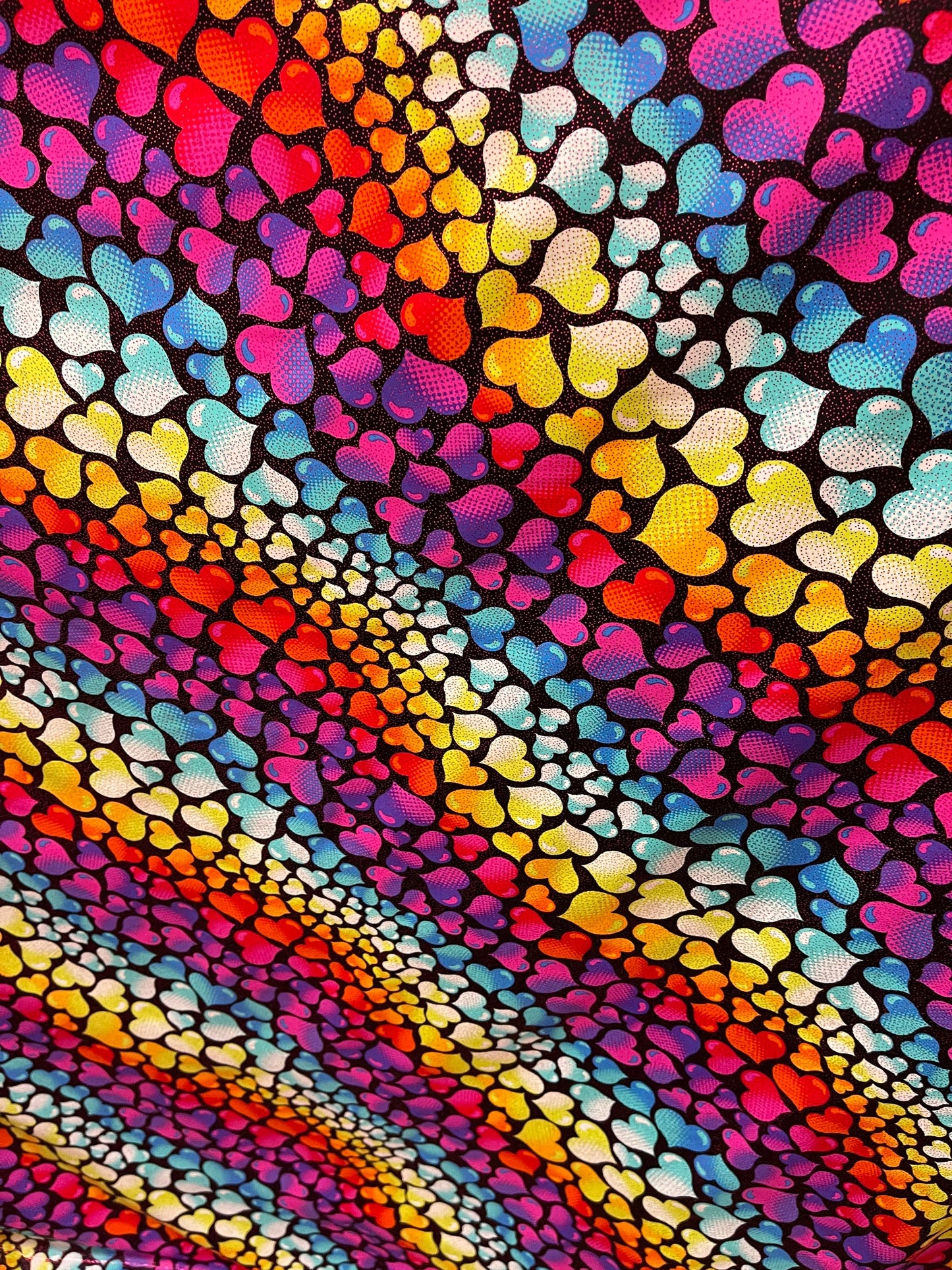 Romantic Love me Hearts design black/multicolor print on best quality of nylon spandex with foil 4-way stretch 58/60” Sold by the YD.