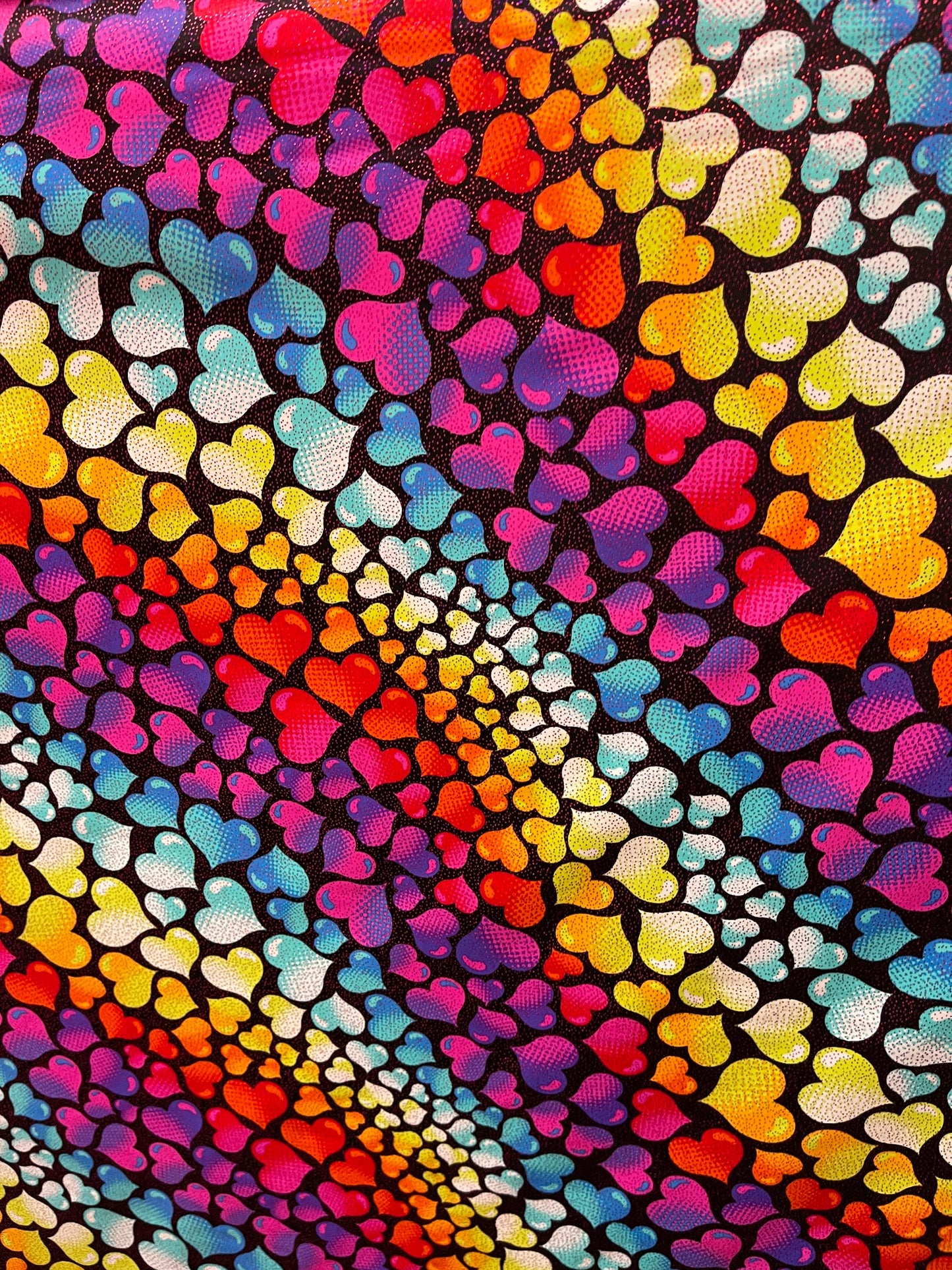 Romantic Love me Hearts design black/multicolor print on best quality of nylon spandex with foil 4-way stretch 58/60” Sold by the YD.