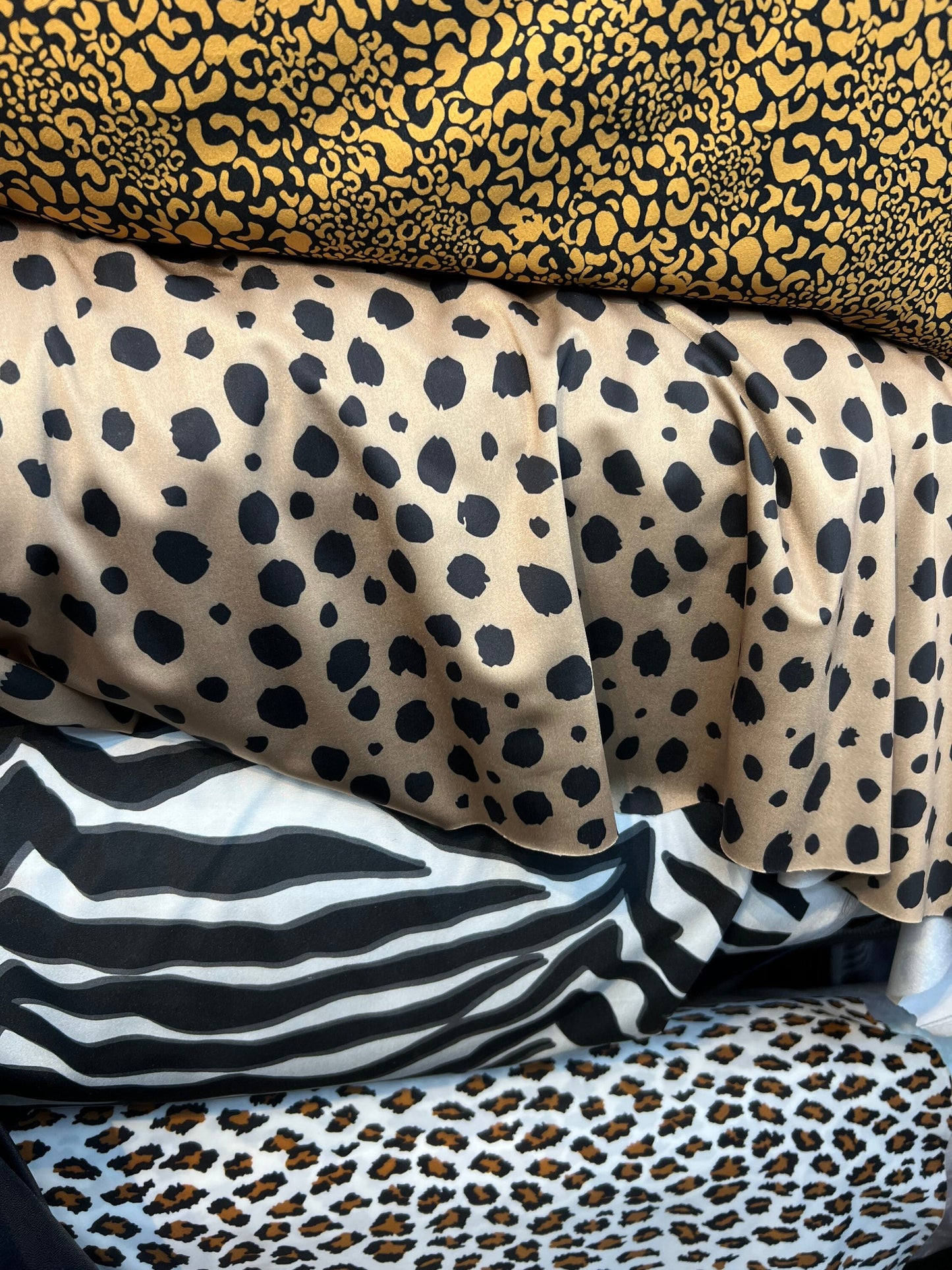 Exotics Multi animal print spandex 4-way stretch 58/60” Sold by the YD. Ships worldwide from Los Angeles California USA.