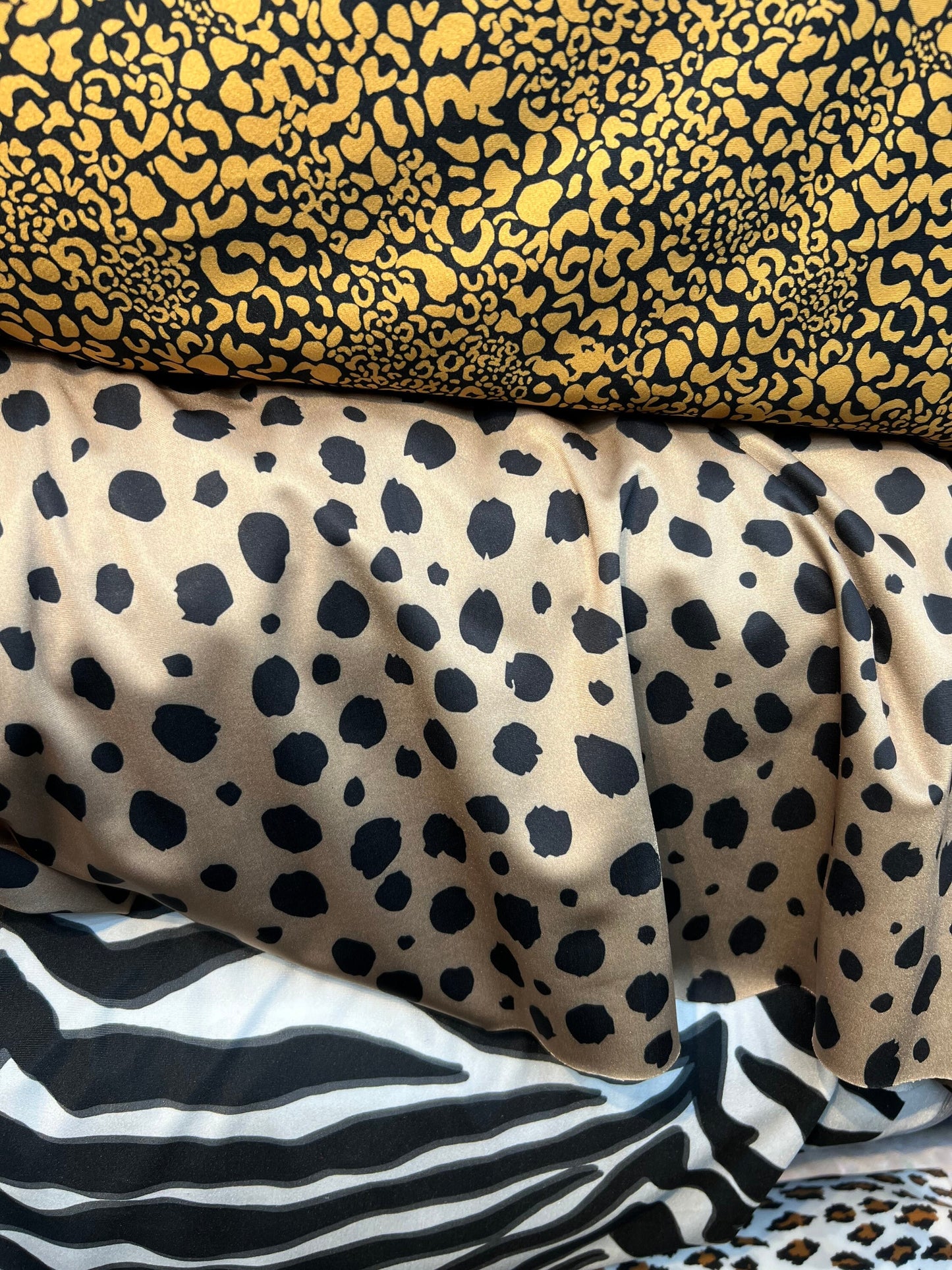 Exotics Multi animal print spandex 4-way stretch 58/60” Sold by the YD. Ships worldwide from Los Angeles California USA.