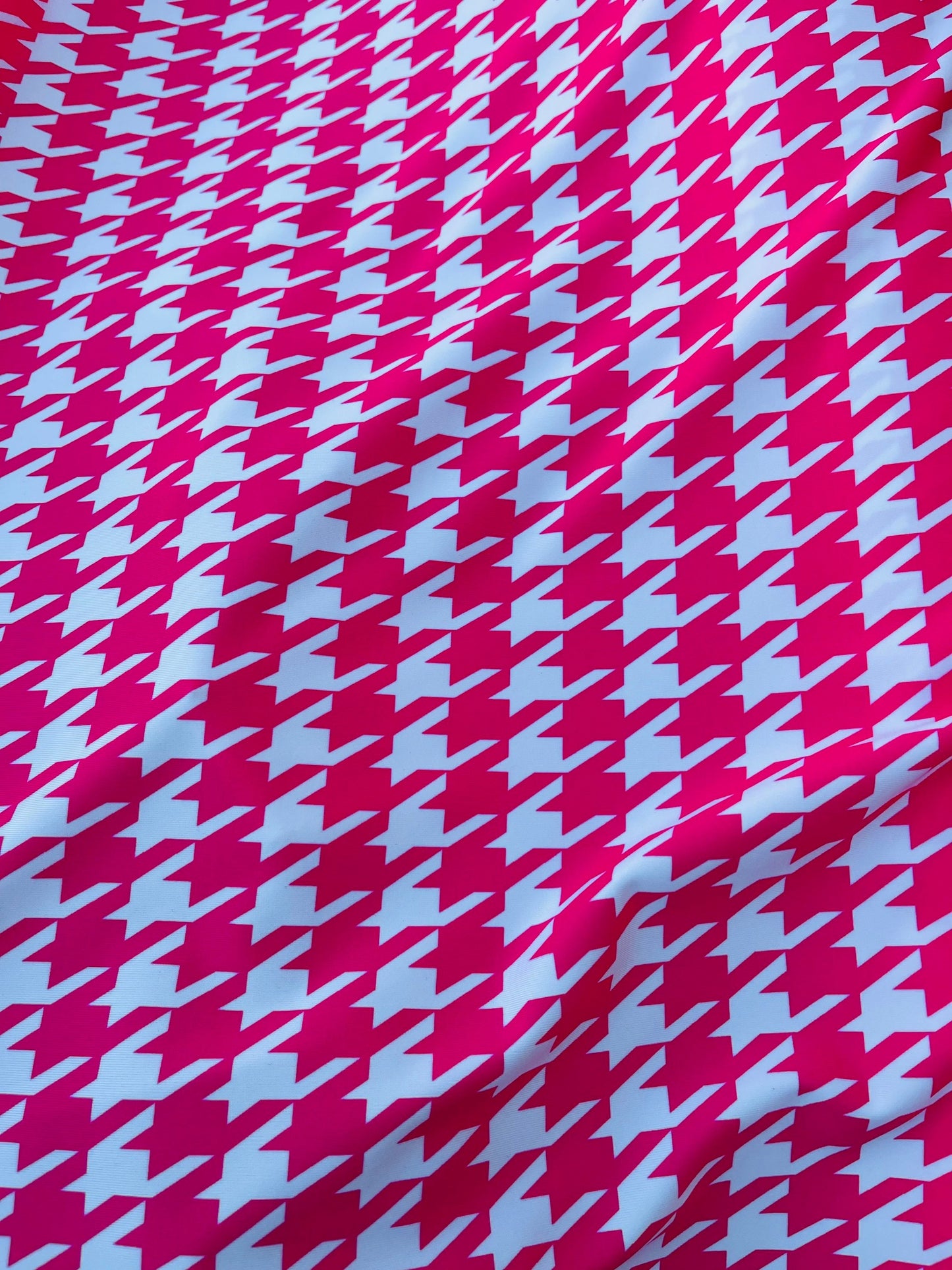Houndstooth design Hot pink/White print on great quality of nylon spandex 4-way stretch 58/60” Sold by the YD. Ships worldwide from L.A CA