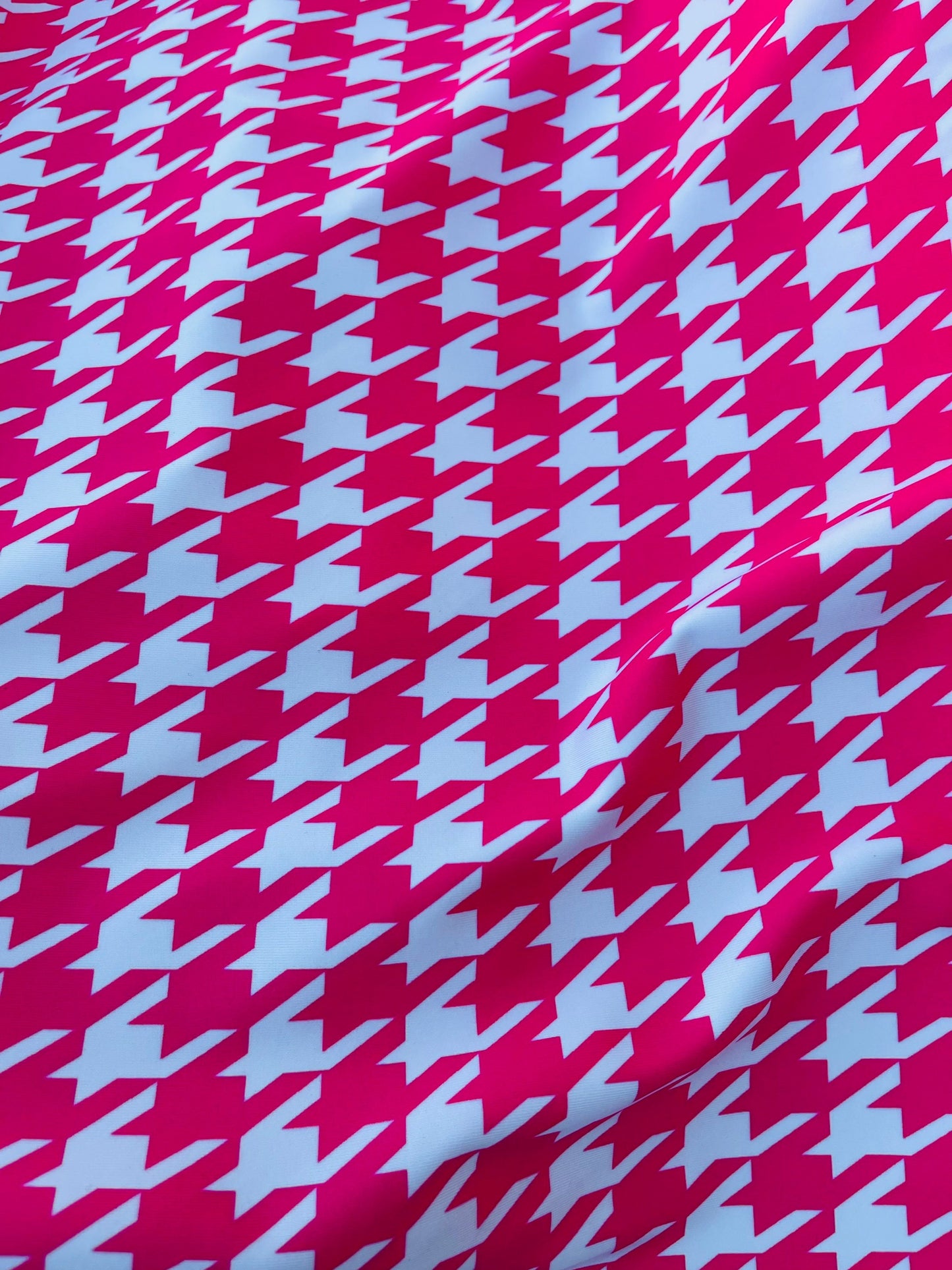 Houndstooth design Hot pink/White print on great quality of nylon spandex 4-way stretch 58/60” Sold by the YD. Ships worldwide from L.A CA