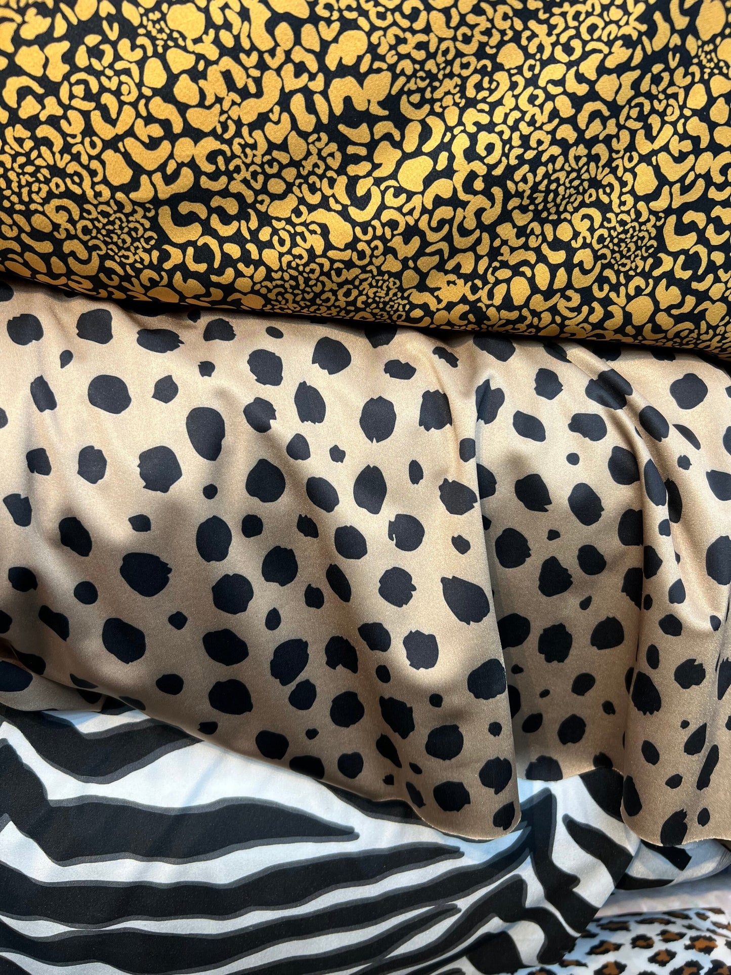 Exotics Multi animal print spandex 4-way stretch 58/60” Sold by the YD. Ships worldwide from Los Angeles California USA.