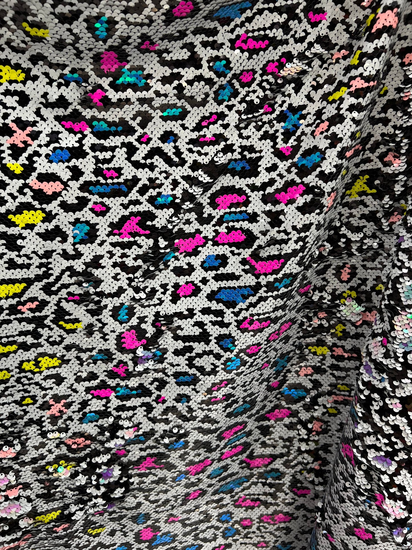 New Exotic leopard on sequins with neon colors 2-way stretch mesh base 55/57” Sold by the YD. Ships Worldwide from Los Angeles California US