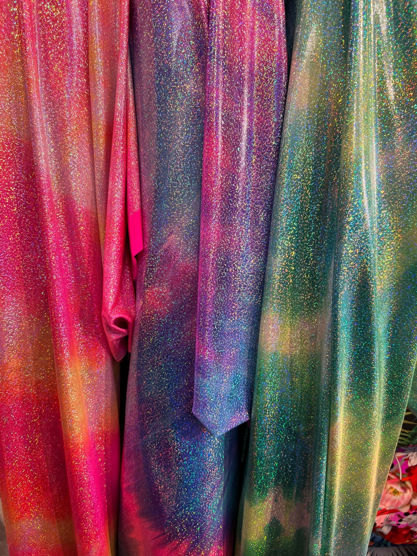 New tie dye design hologram metallic nylon spandex with foggy foil all over 4-way stretch 58/60” Sold by the YD. Ships worldwide