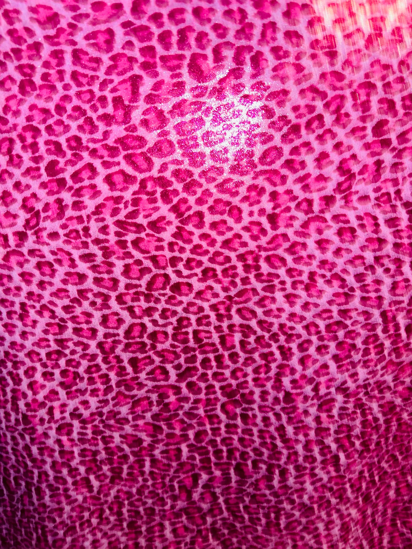Wild Cheetah design on foggy foil hologram metallic nylon spandex 4-way stretch 58/60” Sold by the YD. Ships worldwide