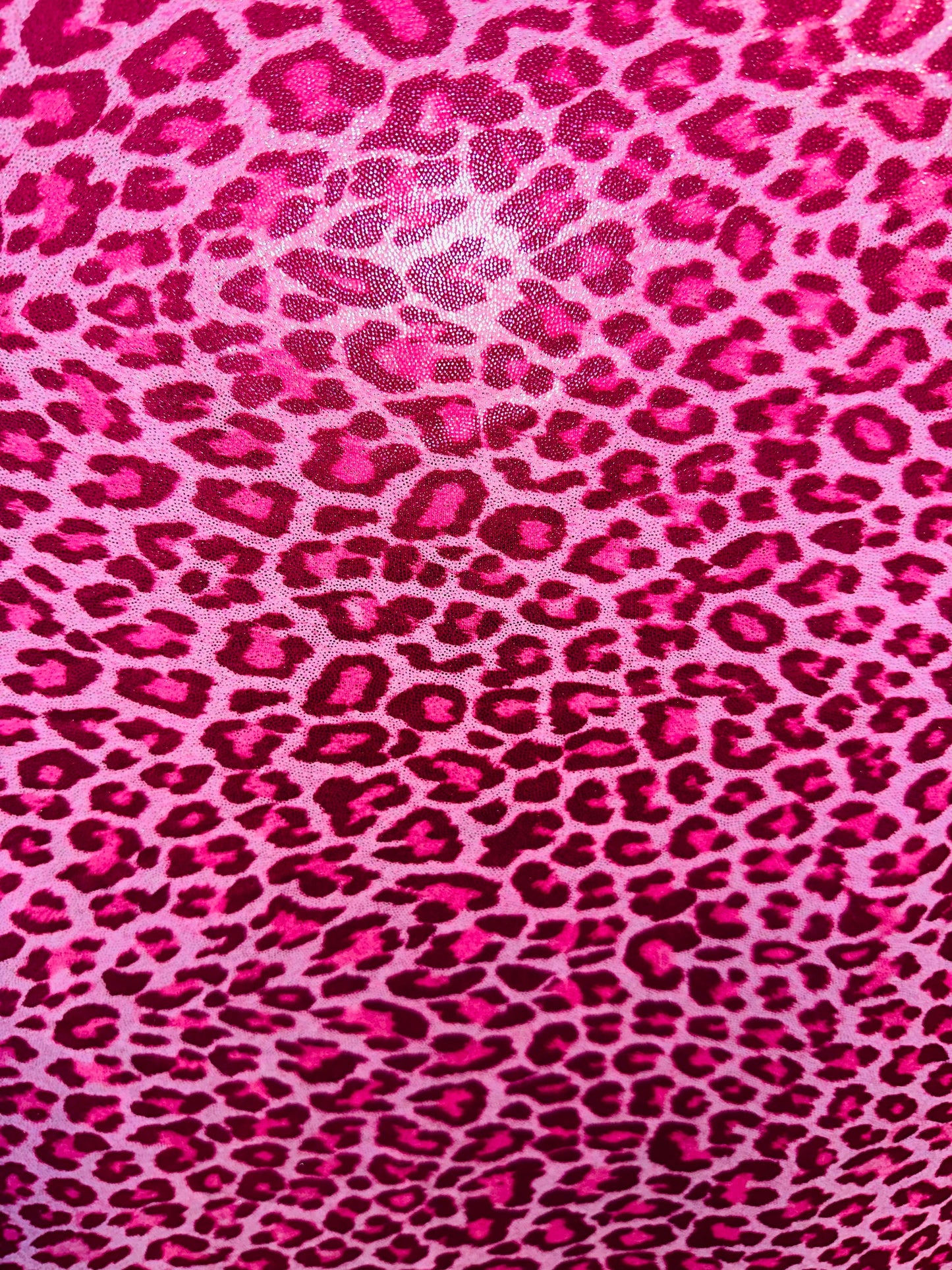 Wild Cheetah design on foggy foil hologram metallic nylon spandex 4-way stretch 58/60” Sold by the YD. Ships worldwide