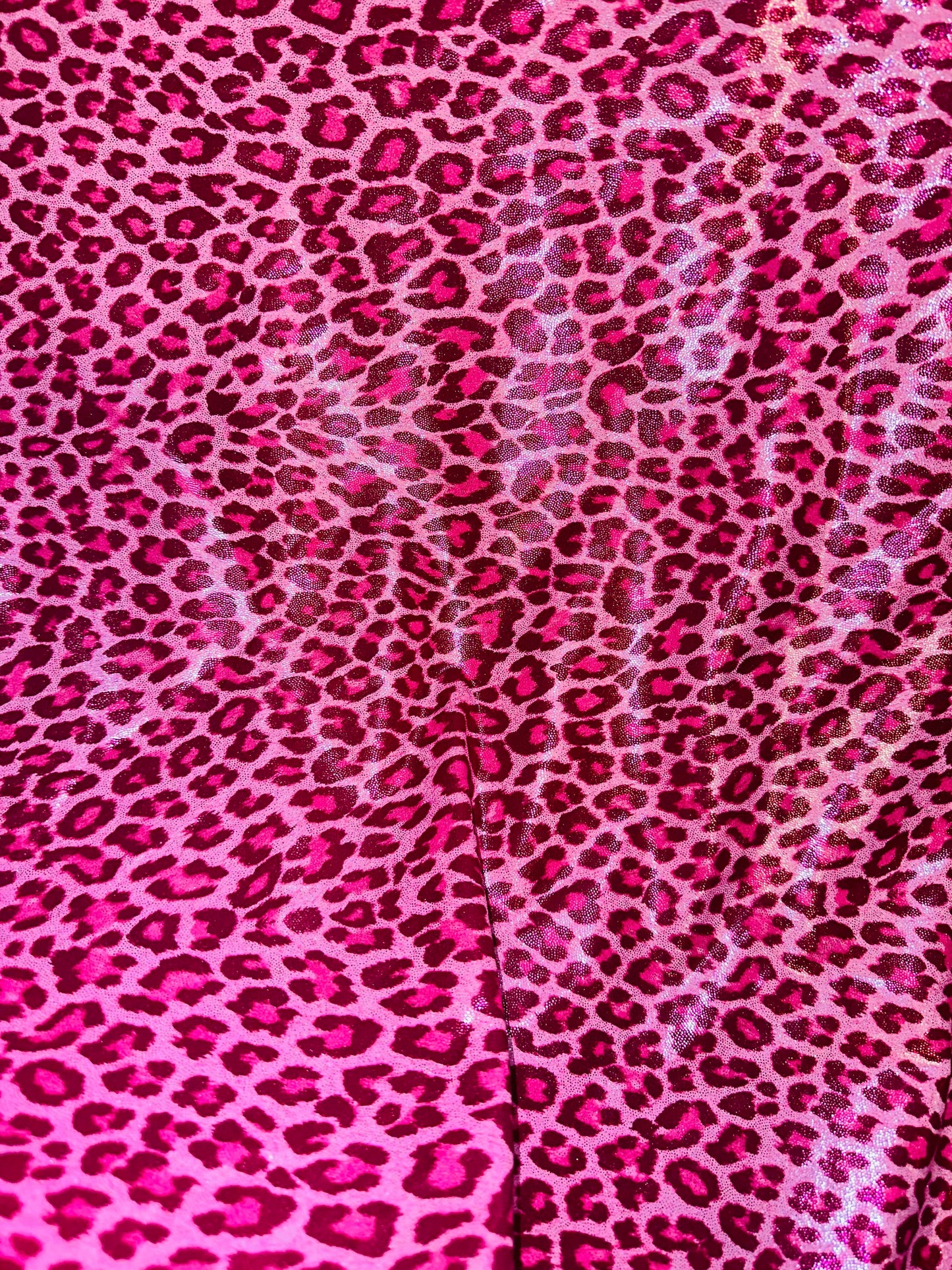 Wild Cheetah design on foggy foil hologram metallic nylon spandex 4-way stretch 58/60” Sold by the YD. Ships worldwide