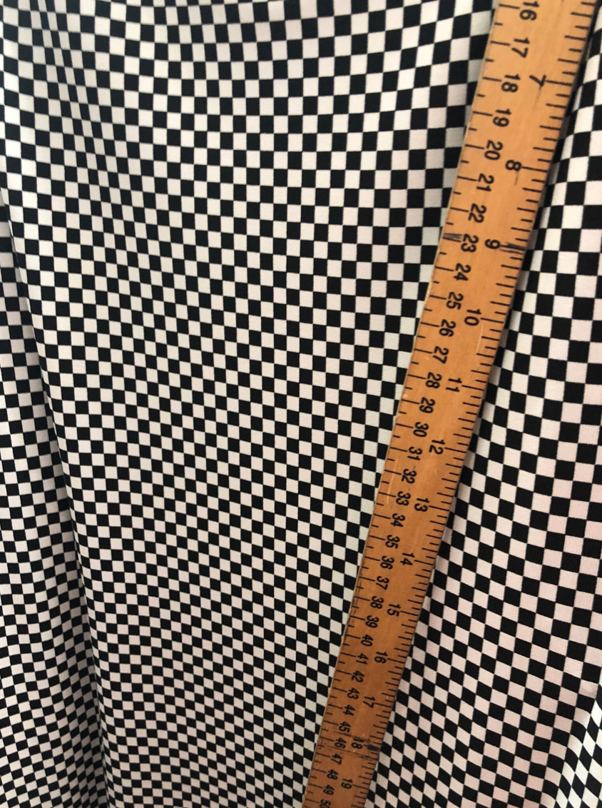 Small checkers design on poly spandex medium weight 58/60"