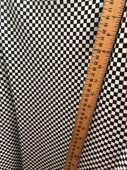 Small checkers design on poly spandex medium weight 58/60"