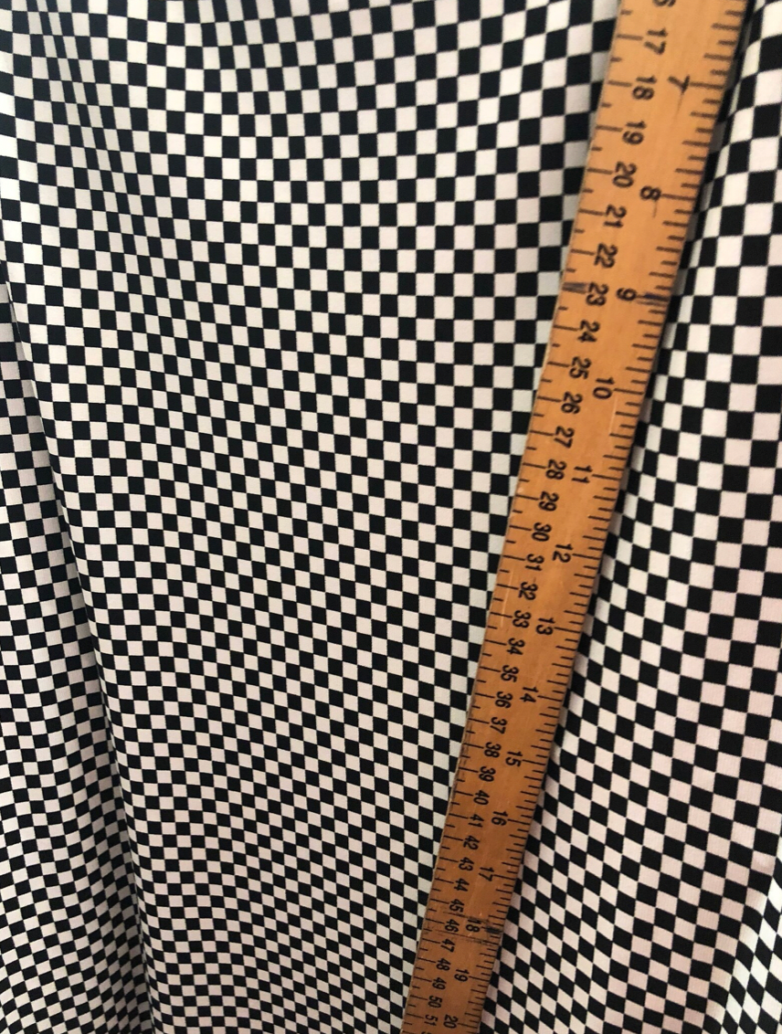 Small checkers design on poly spandex medium weight 58/60"