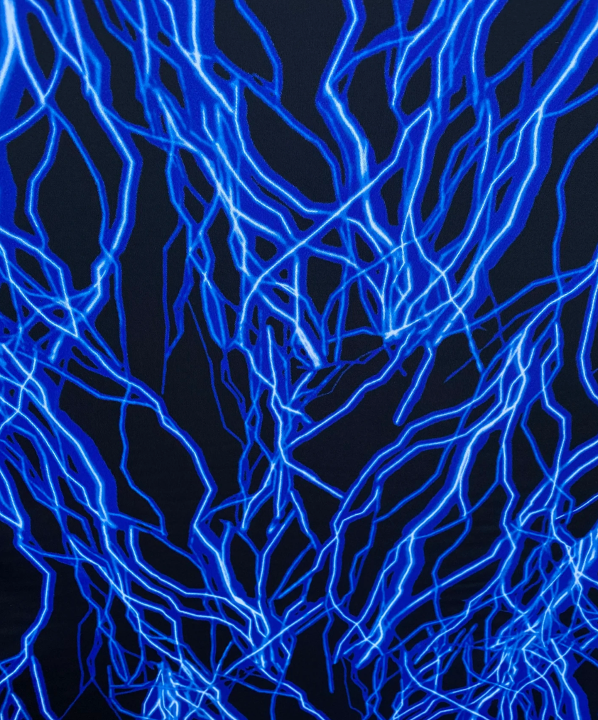 Vivid Lightning thunder print on best quality of nylon spandex it glows under black light 4-way stretch 58/60” Sold by the YD. Ships worldwi