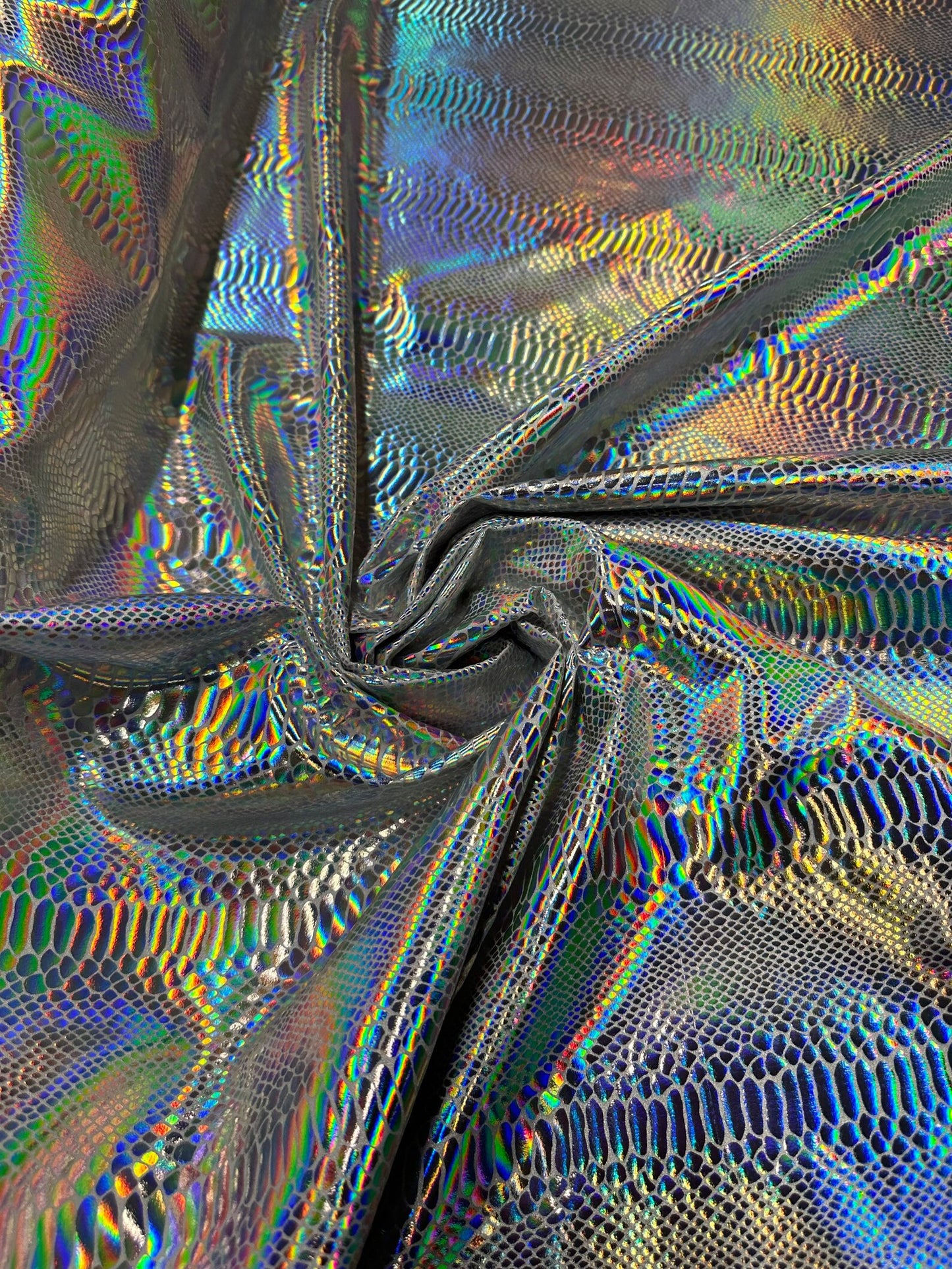 Cobra snake design white/iridescent silver hologram metallic nylon spandex 4-way stretch 58/60” Sold by the YD.