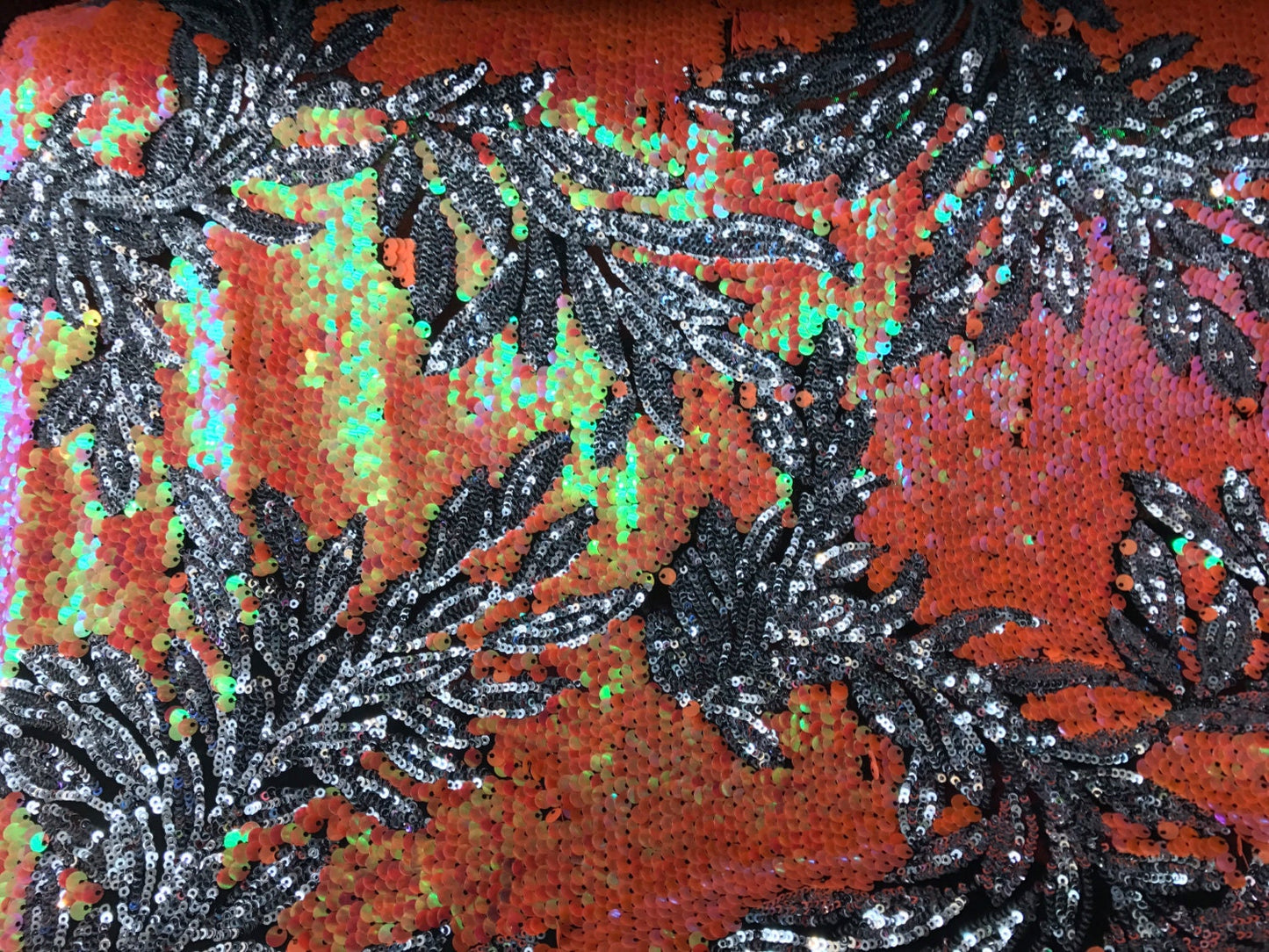 Iridescent Hawaii design 2 tone sequins on mesh base 58/60" sold by the yd. Ships worldwide from Los Angeles California USA